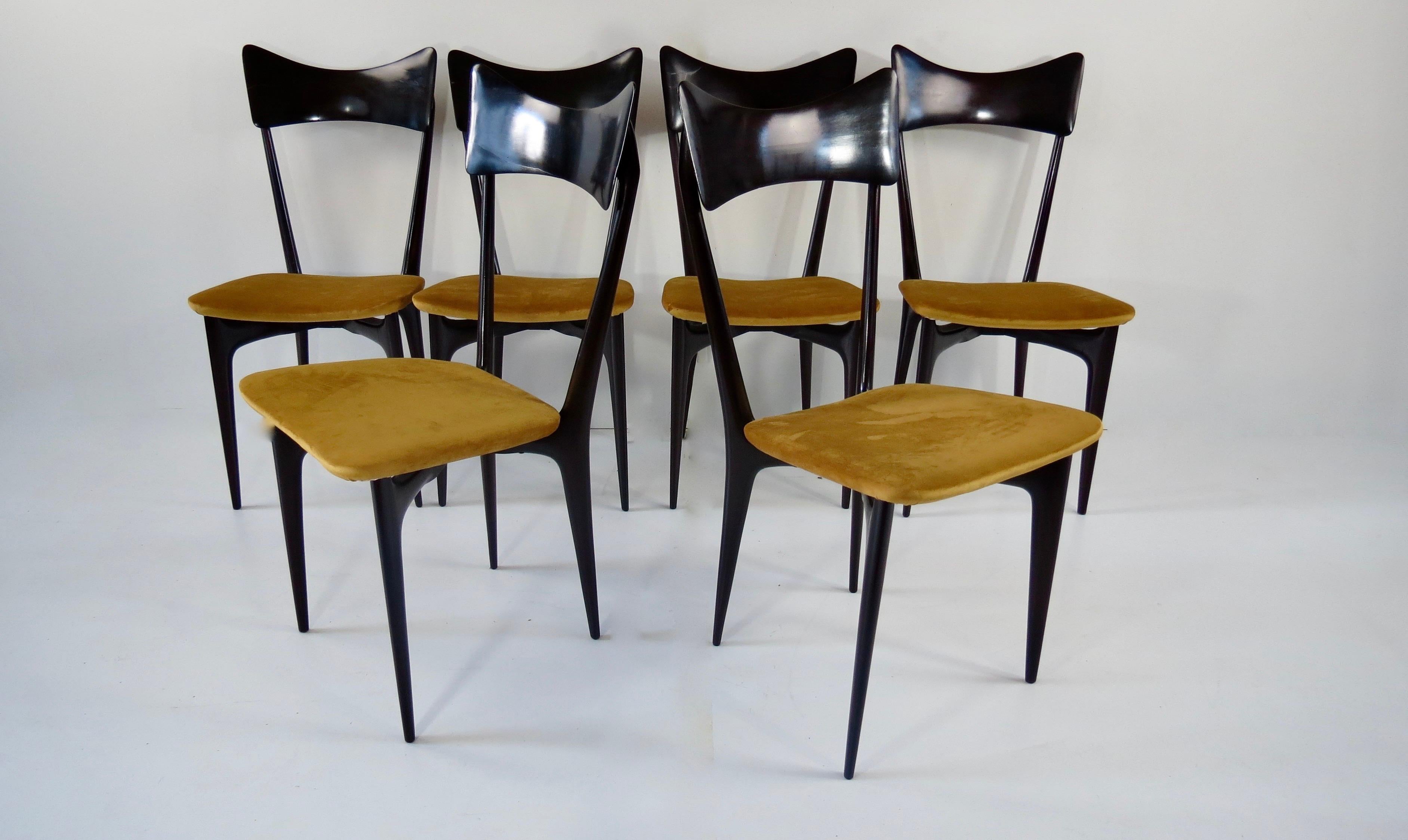 Set of iconic Ico & Luisa Parisi dining chairs
manufactured by Ariberto Colombo, Cantù, circa 1952
this version with a wooden backrest is a later version;
the original version is with a seat pad covered with red synthetic leather then
