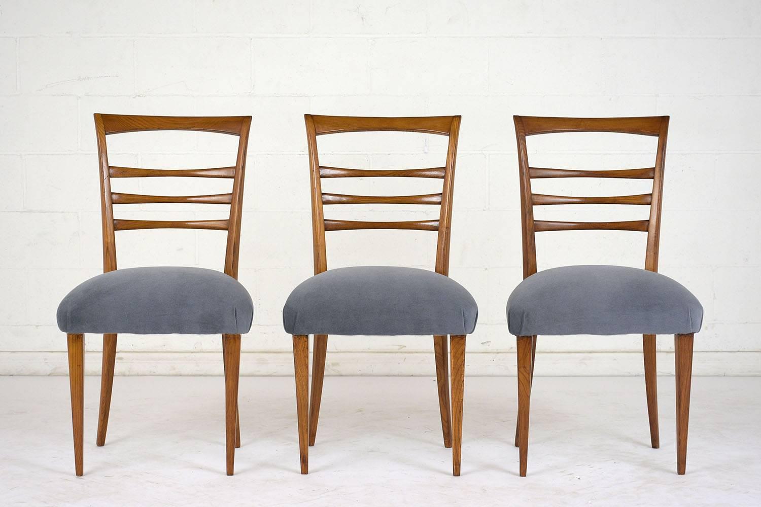 This Set of Six 1960s Mid-Century Modern Dining Chairs are fully restored, made out of solid wood, and has been stained in a rich walnut color with a newly lacquered finish. The set features a high back ladder design, seat cushions newly upholstered