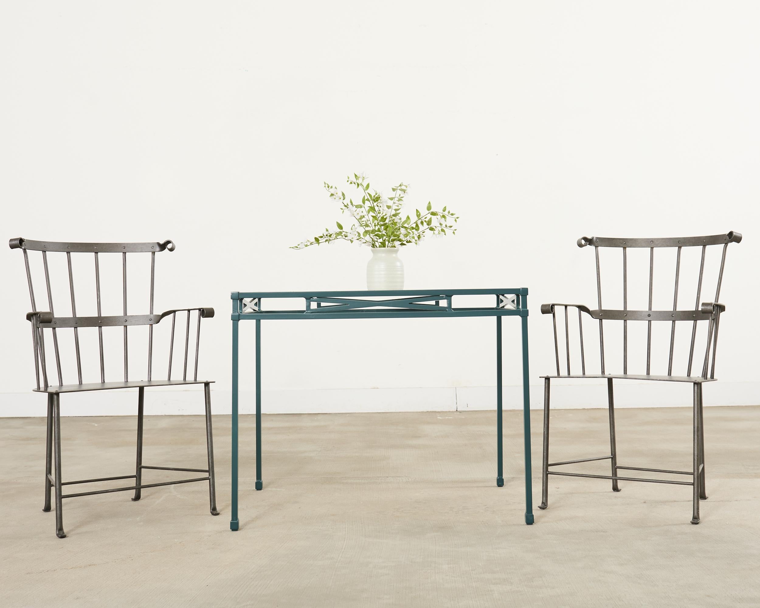 Fantastic set of six spindle back Windsor chairs crafted from iron designed by Munder Skiles. The chair frames are crafted from thick iron that is heavy and solid with excellent joinery and craftsmanship. The chairs have a tall spindle or comb back