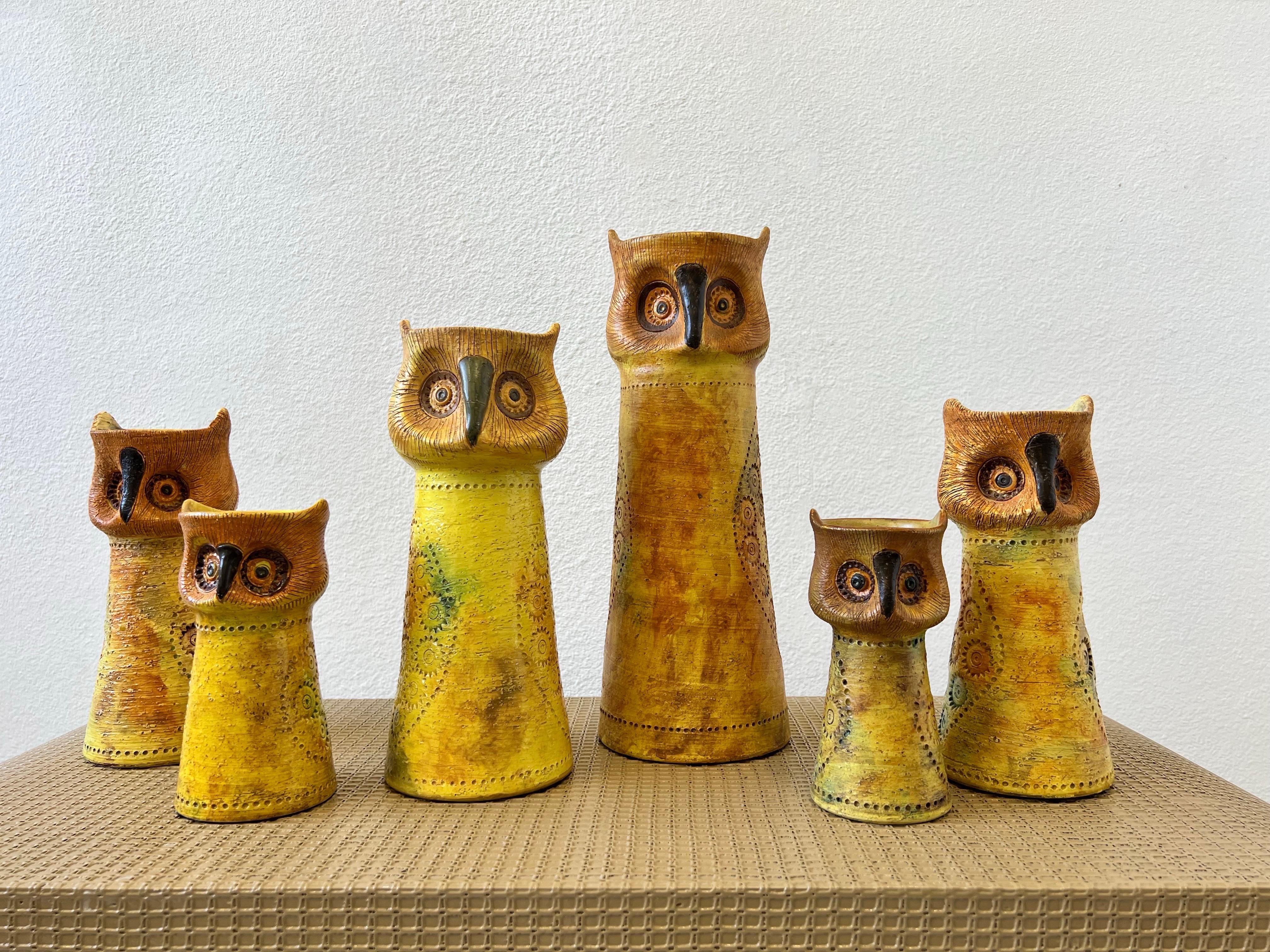 A rare set of six Italian ceramic owls by Aldo Londi for Bitossi, imported by Rosenthal & Netter. five of the owls are candleholder and one is a vase. All of the owls are marked made in Italy and have the Rosenthal & Netter label. 
In beautiful