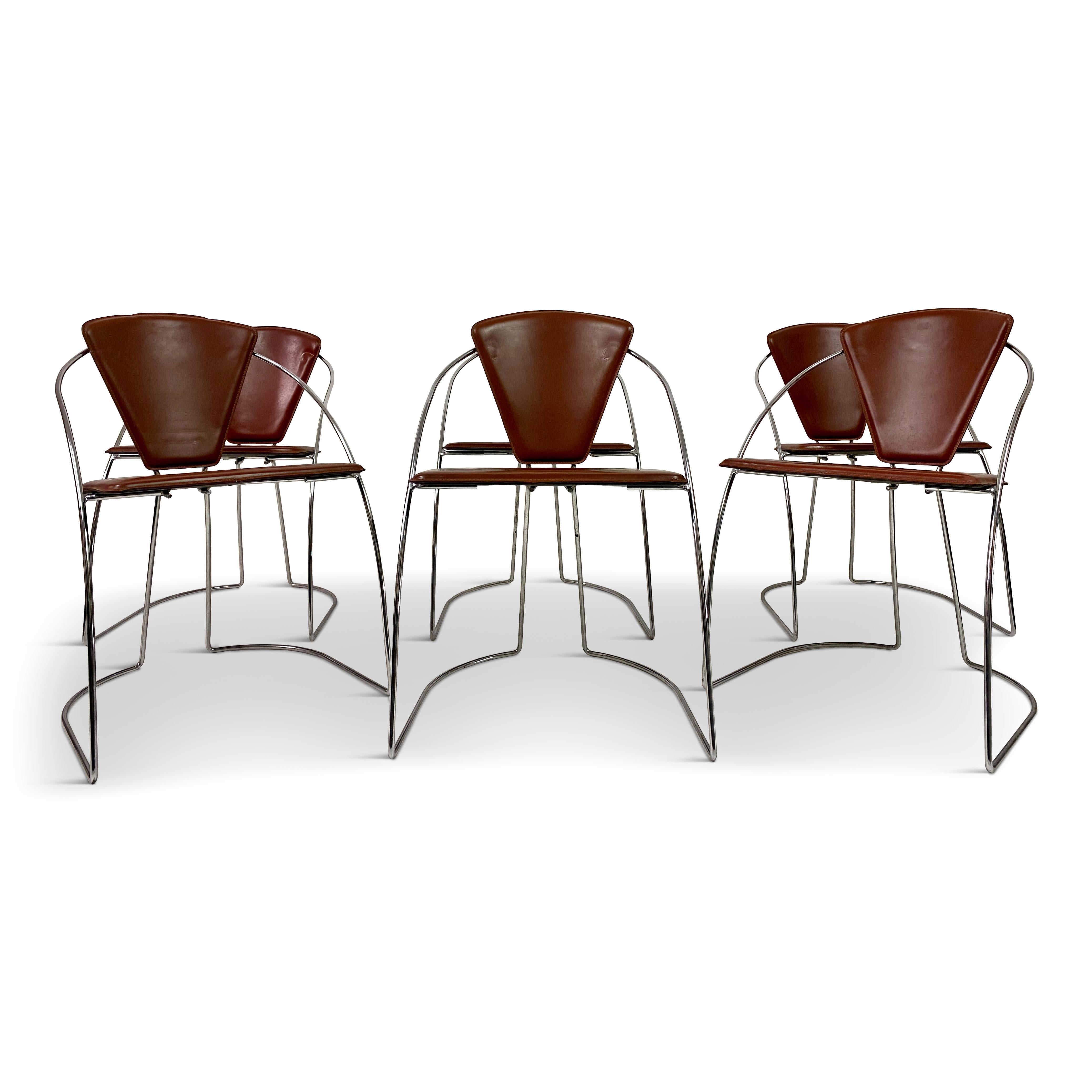 Six dining chairs

Chromed steel tubular frames

Red leather seats and back

Postmodern style

Italy, 1980s.