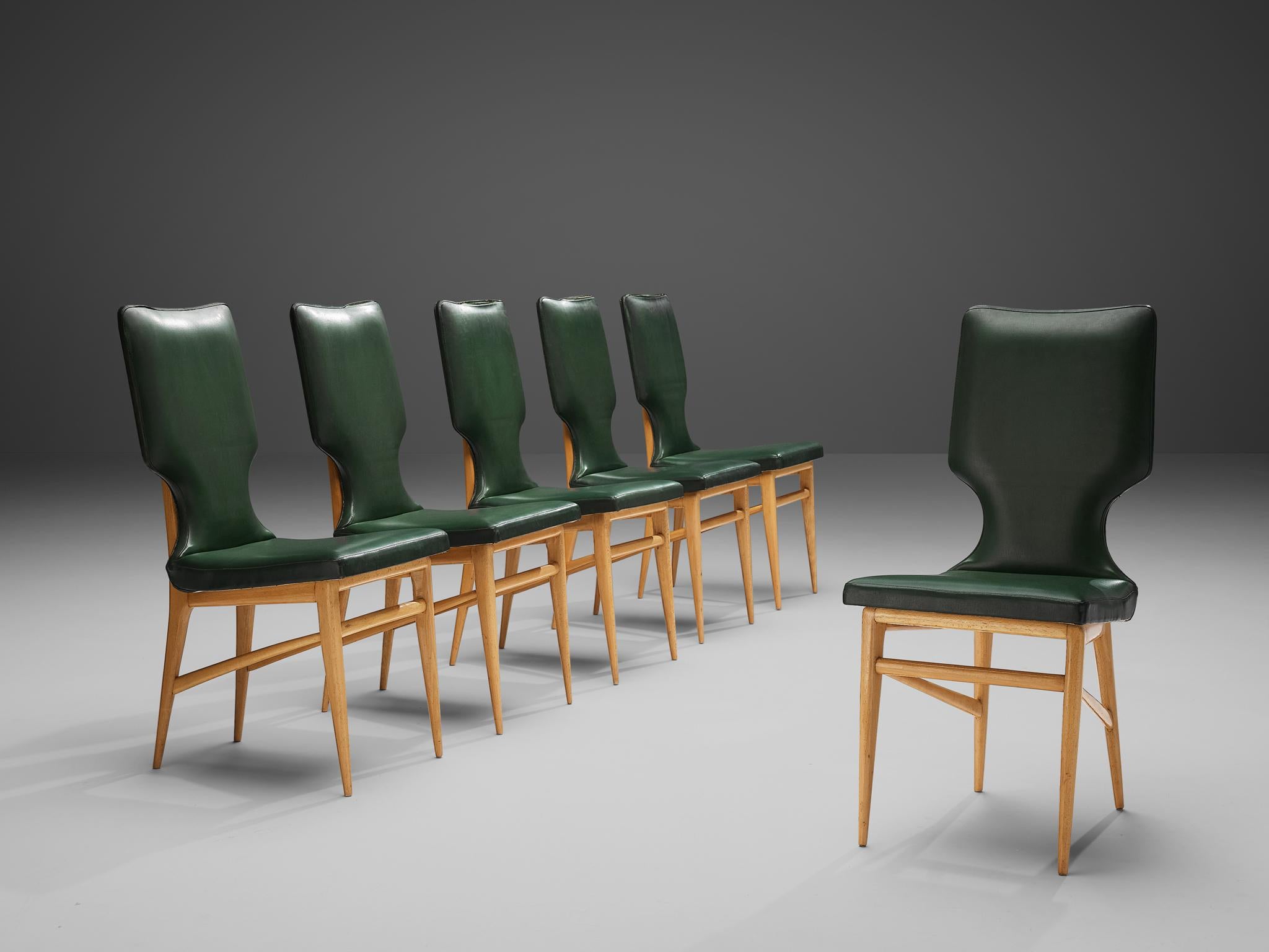 Set of six dining chairs, beech, green leatherette, Italy, 1950s
 
The Italian design of this set of six dining chairs emphasizes the contrast between its two materials: A distinct shaped frame in bright beech wood and a green colored geometric