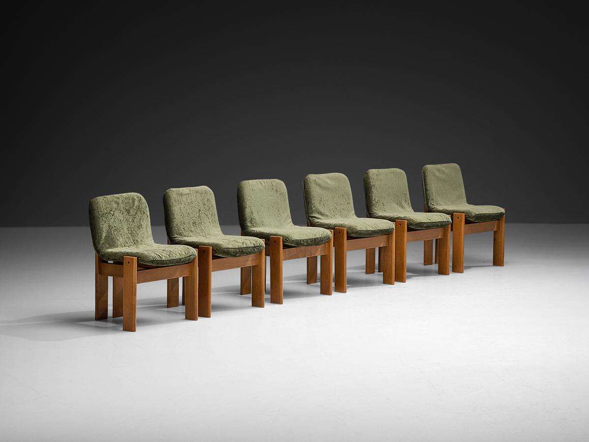 Set of six dining chairs, beech, fabric, Italy, 1960s 

This elegant set of six Italian dining chairs from the 1960s showcases a refined balance between architectural precision and timeless craftsmanship. Showing strong resemblances to iconic