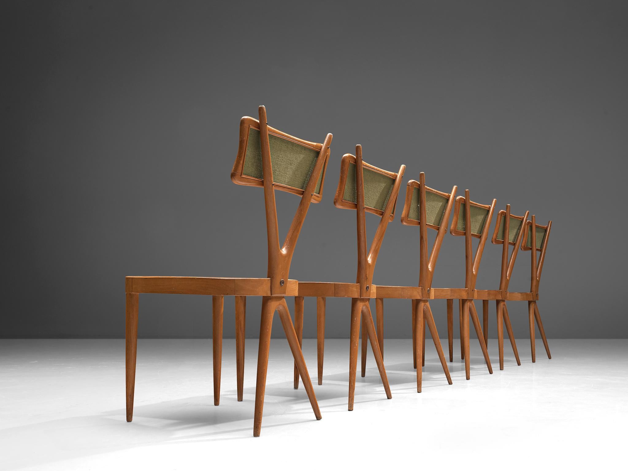 Gianni Vigorelli, Satz von sechs Esszimmerstühlen, Buche, Sperrholz, Stoff, Italien, 1950er Jahre.

Diese Stühle sind wunderschön konstruiert und verfügen über einen X-förmigen Rahmen, ein auffälliges Detail, das optisch überzeugt. Die Rückenlehne