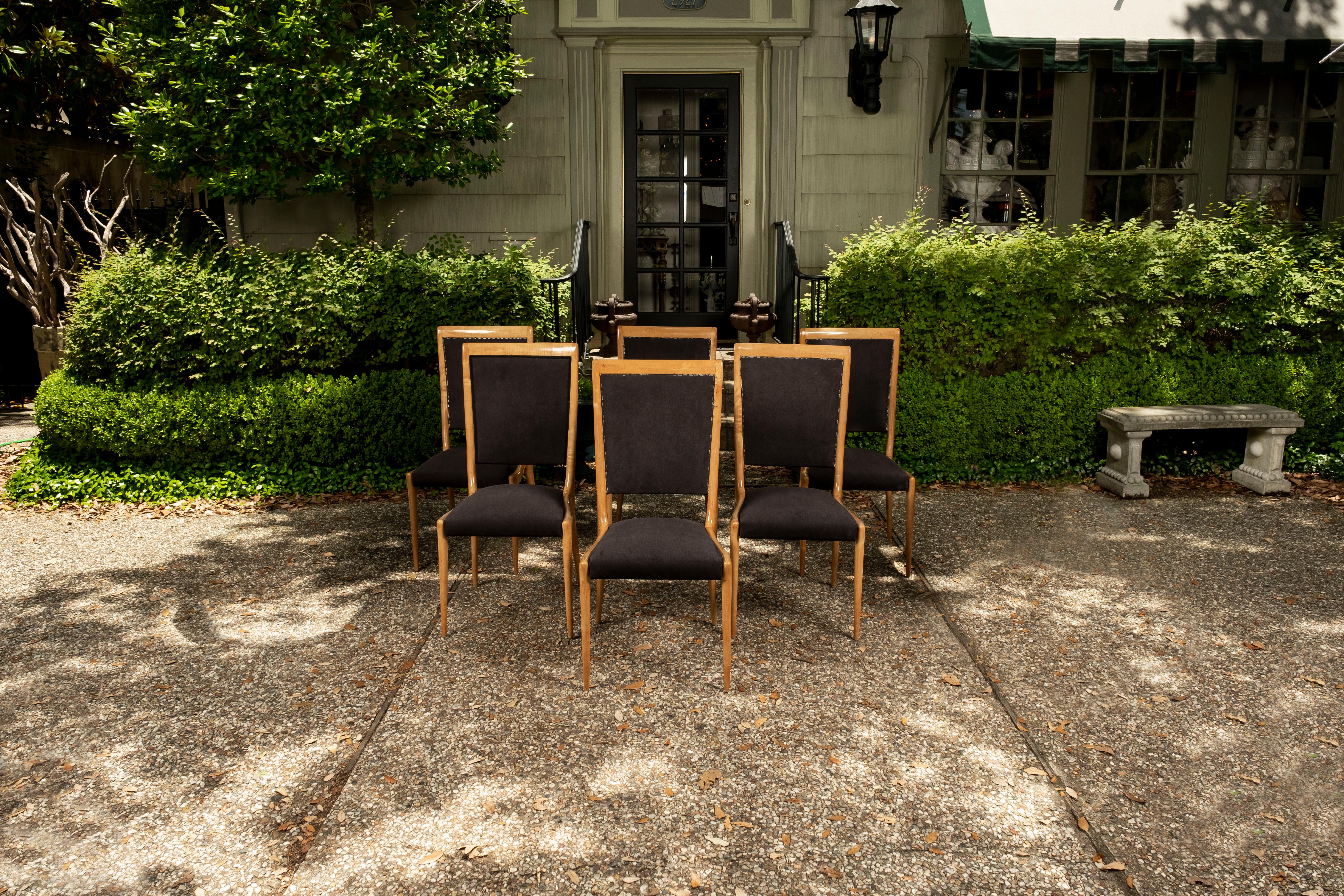 Italian Mid Century dining chairs After Gio Ponti.
Set of six Italian mid-century fruitwood dining chairs after Gio Ponti. These exceptional Italian modern dining chairs are generous in size and extremely comfortable.
This chic set of Italian