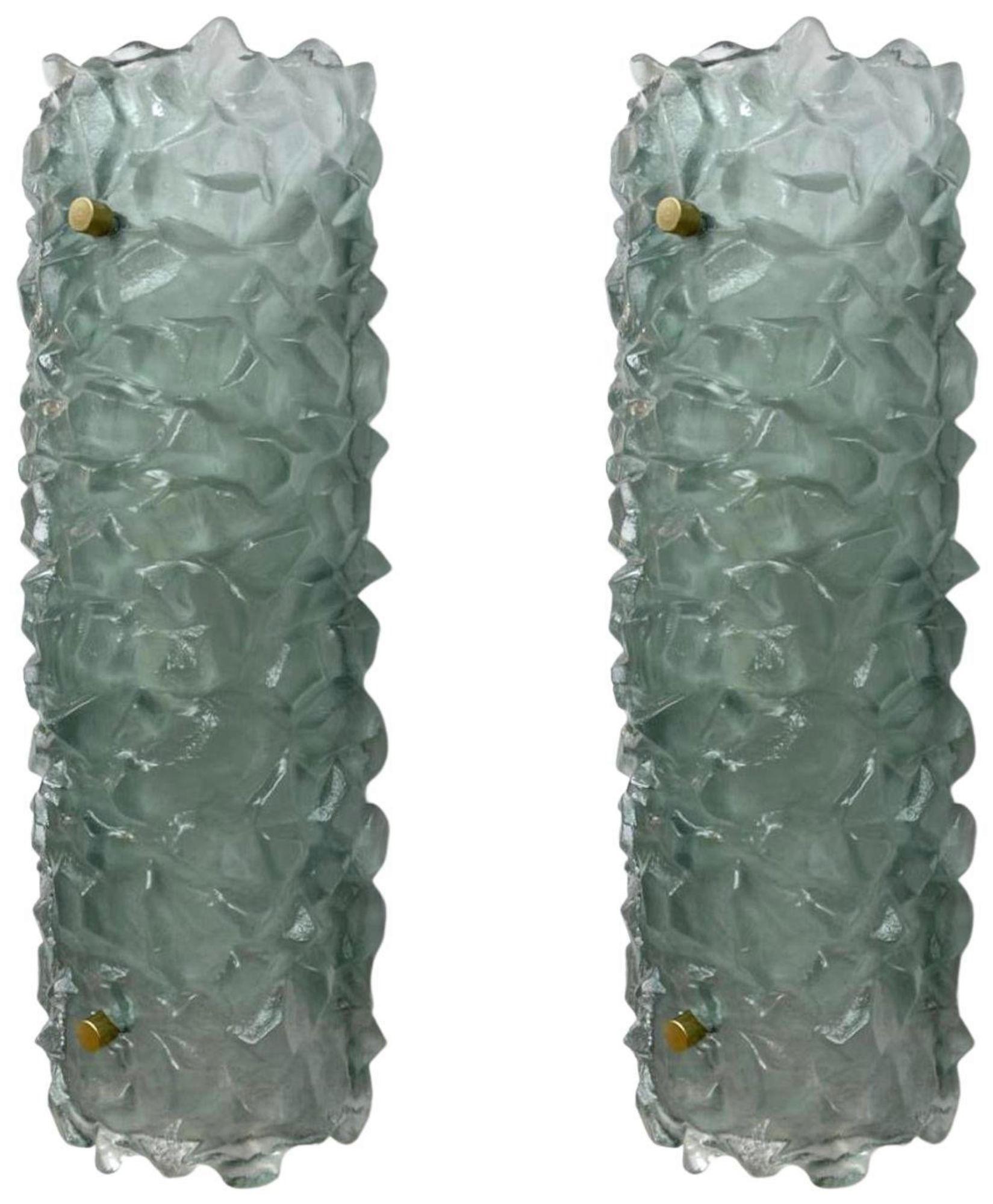 Italian modern wall lights/sconces with thick textured light green Murano glass shades mounted on white metal frames / Made in Italy, 1980's.
Measures: height 20.5 inches, width 7 inches, depth 5 inches