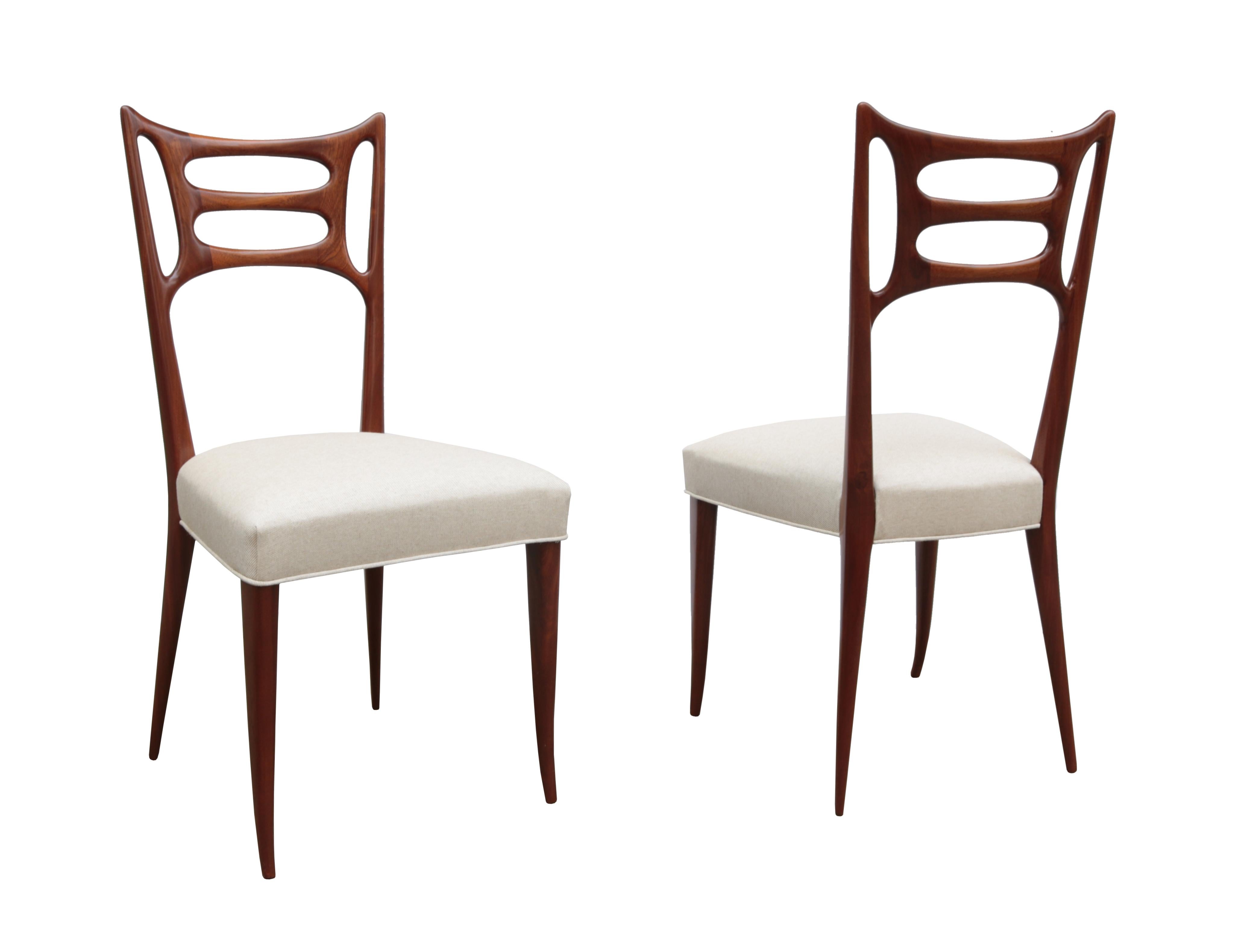 Set of Six Italian Modernist dining chairs
Walnut back and legs with upholstered seat.