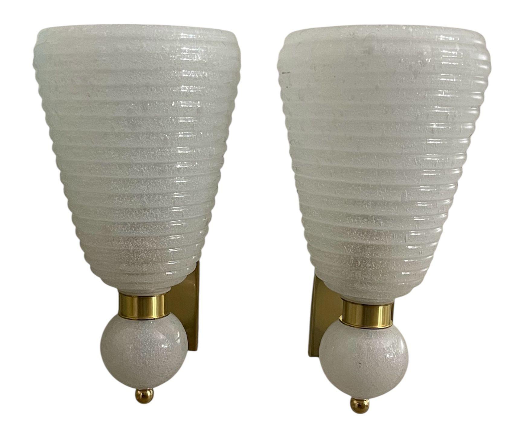 Elegant set of six contemporary Italian wall sconces, handblown in Murano glass using the circoli pulegoso technique, which creates a richly textured surface filled with delicate bubbles. The glass features subtle white gold flecks that shimmer when