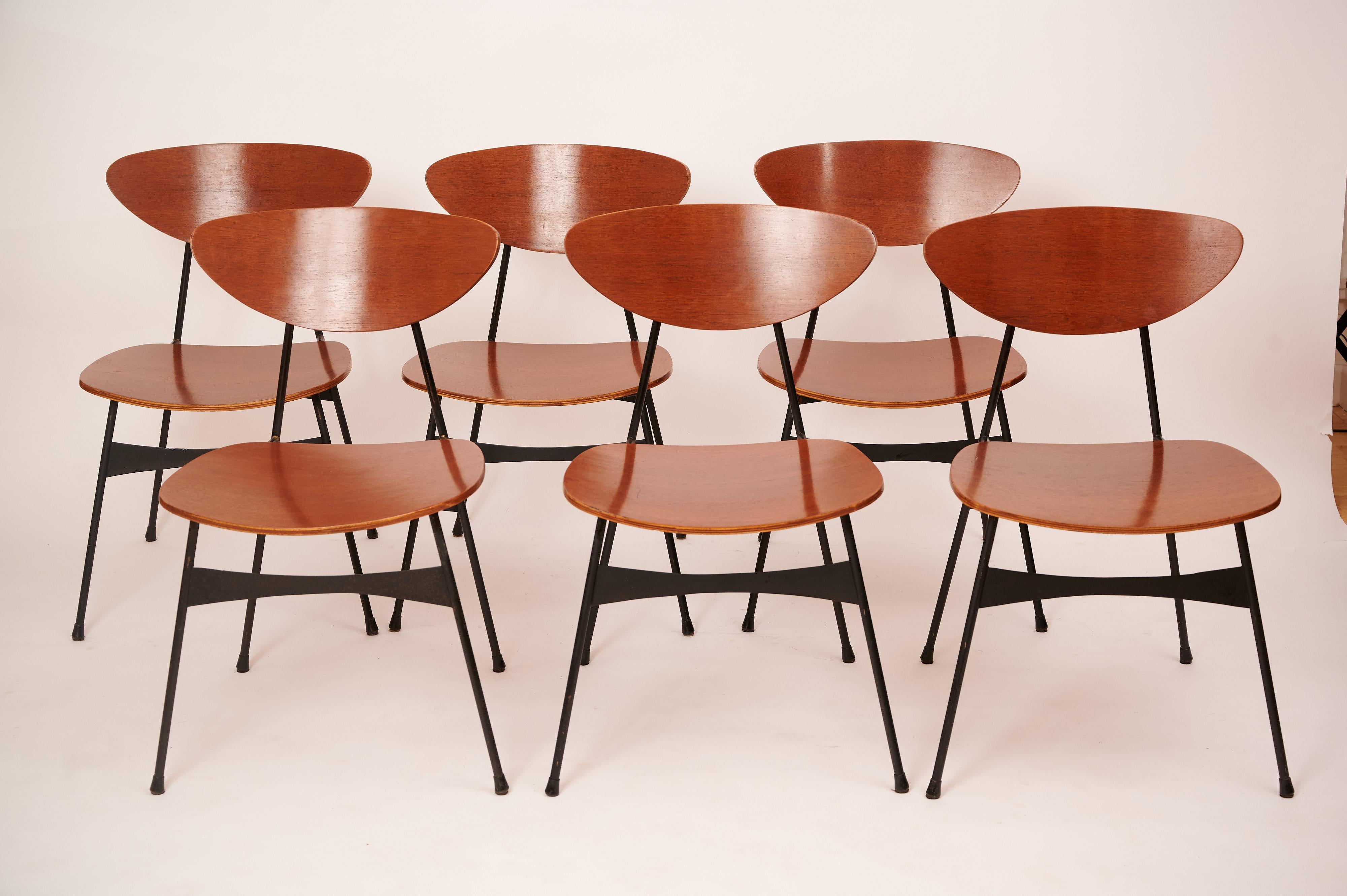 A set of six Italian plywood and black metal chairs. 


