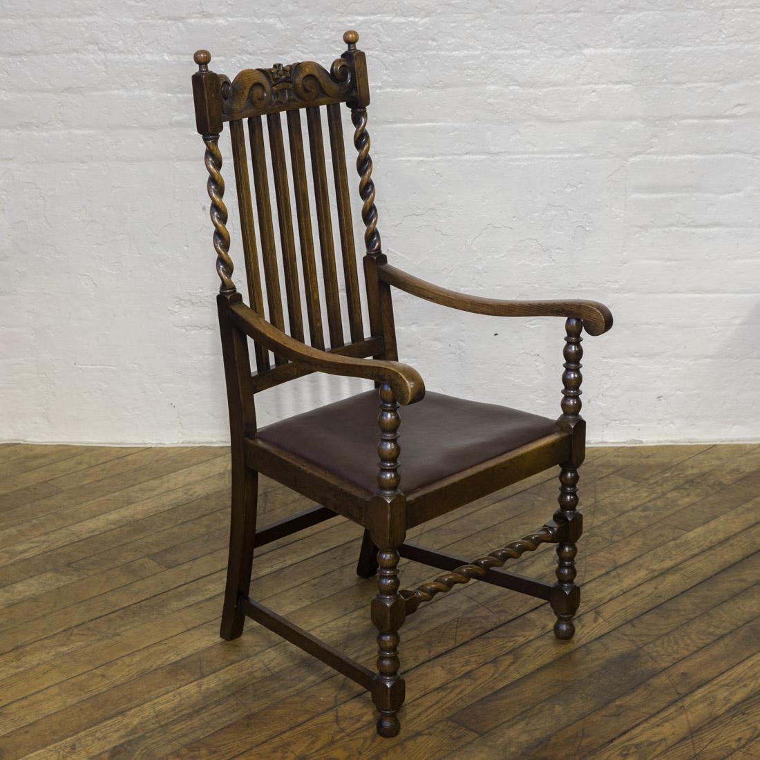 A wonderful set of six solid oak chairs with a strong Jacobean influence. The latted backs have barley twist uprights which compliment the front stretchers. Along with the crested top rail these make for a very attractive set of six chairs (two