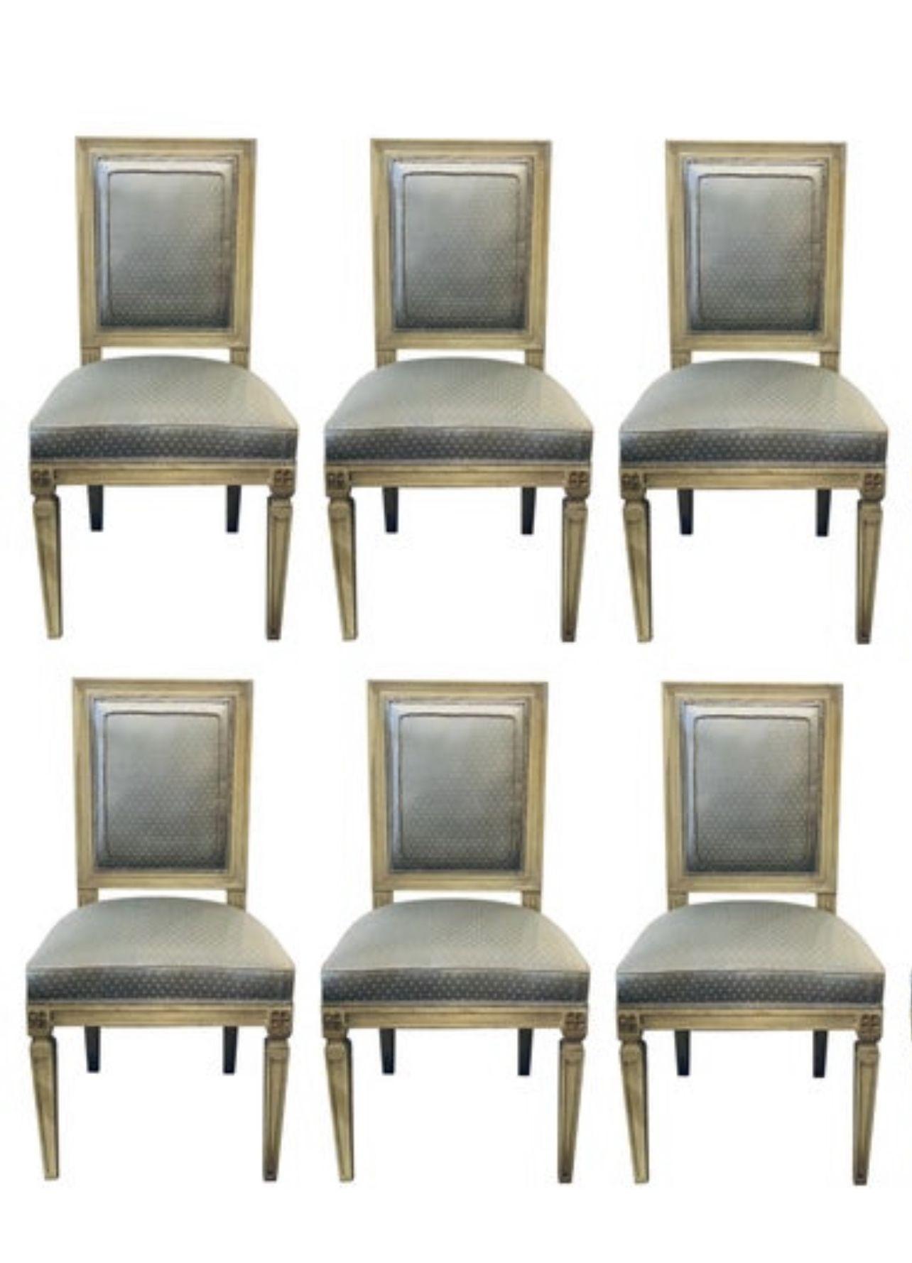 Set of Six Maison Jansen Style Parcel Gilt and Paint Decorated Louis XVI style Dining or Side Chairs. Each in a new upholstery with new springs and welts. The set with fine sleek and clean lines in a linen grayish blue form of parchment faux paint