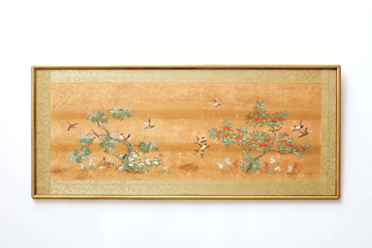 Extraordinary set of six Japanese painted panels depicting flora and fauna. Features intricately painted scenes of colorful birds among various flowers and trees. Each painting mounted on masonite board and set in a gilt wooden frame with a silk