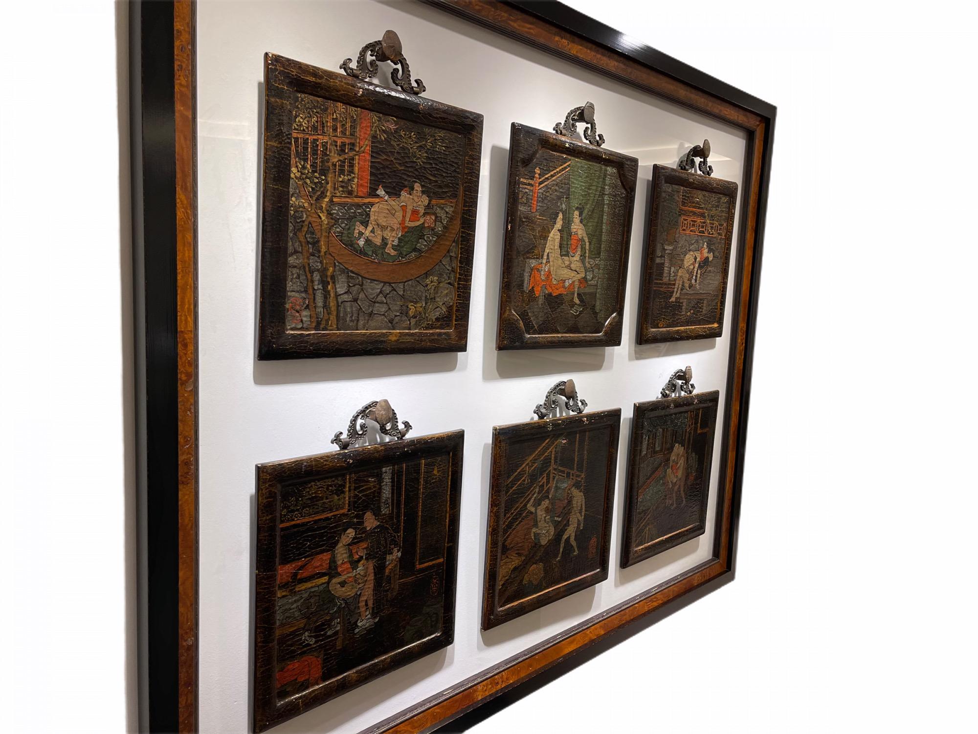These magnificent lacquered wood panels have been mounted together on a lucite panel. Each panel has its original hanging handle. The panels are hanging on antique railroad pins that have been cut and attached to the lucite panel. It has been framed