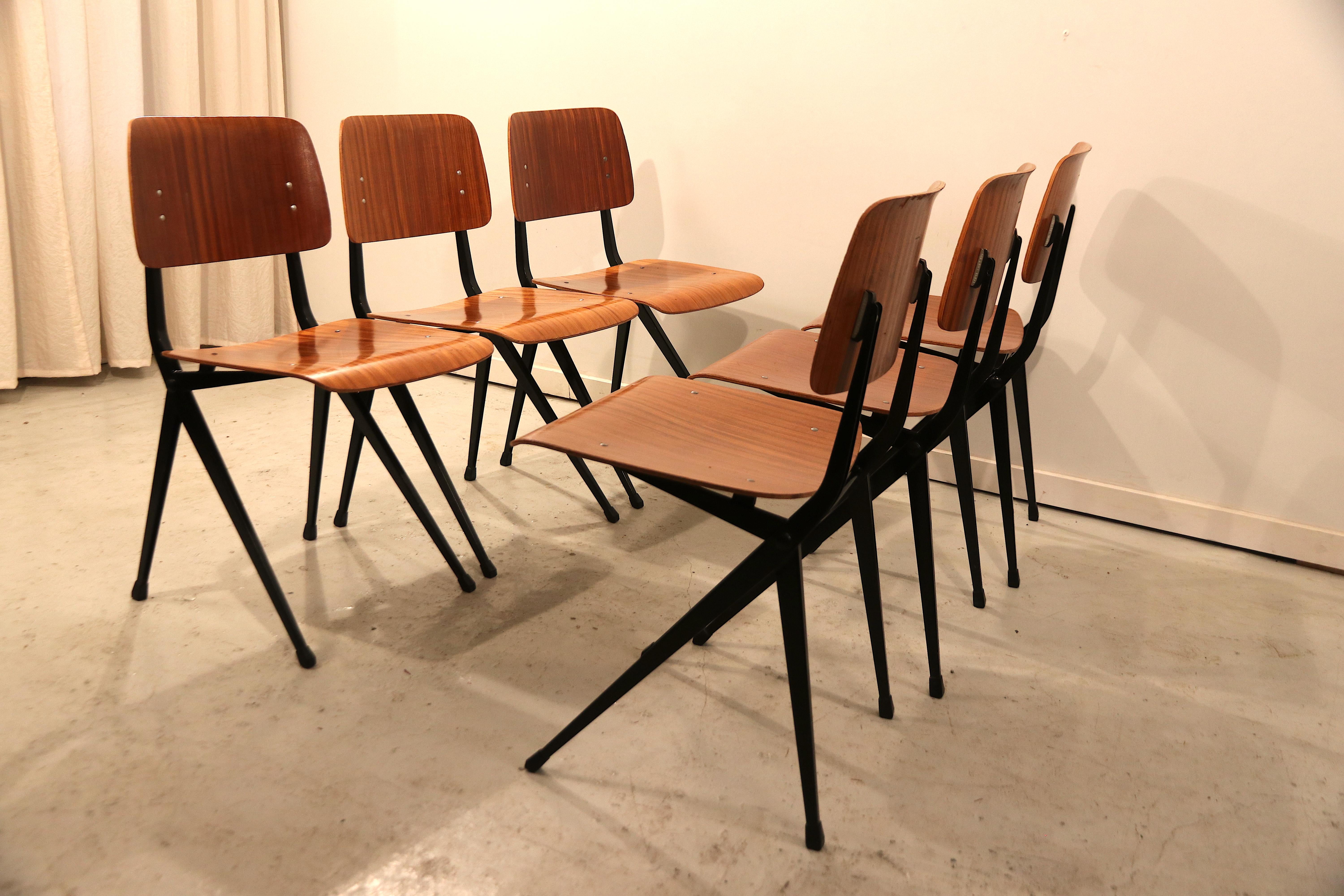 Set of 6 industrial spider leg or compass-needle leg chairs with a beautiful plywood seat and backrest. These are slightly larger than the usual type of seat and back that is typically used for these chairs (see other listing). This makes them more
