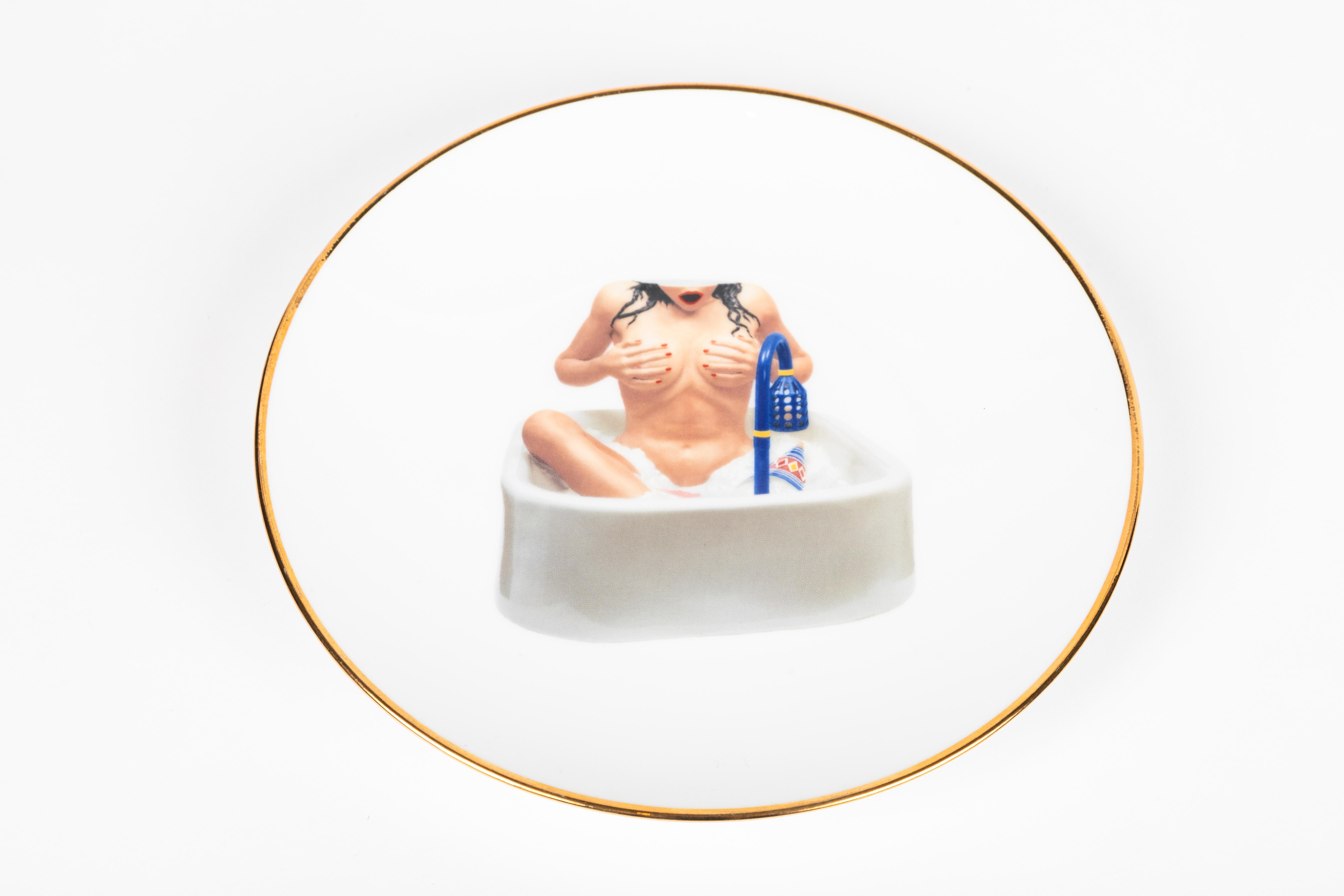 Set of six Banality series porcelain dessert plates by Jeff Koons for Bernardaud. Edition of 4500. 

