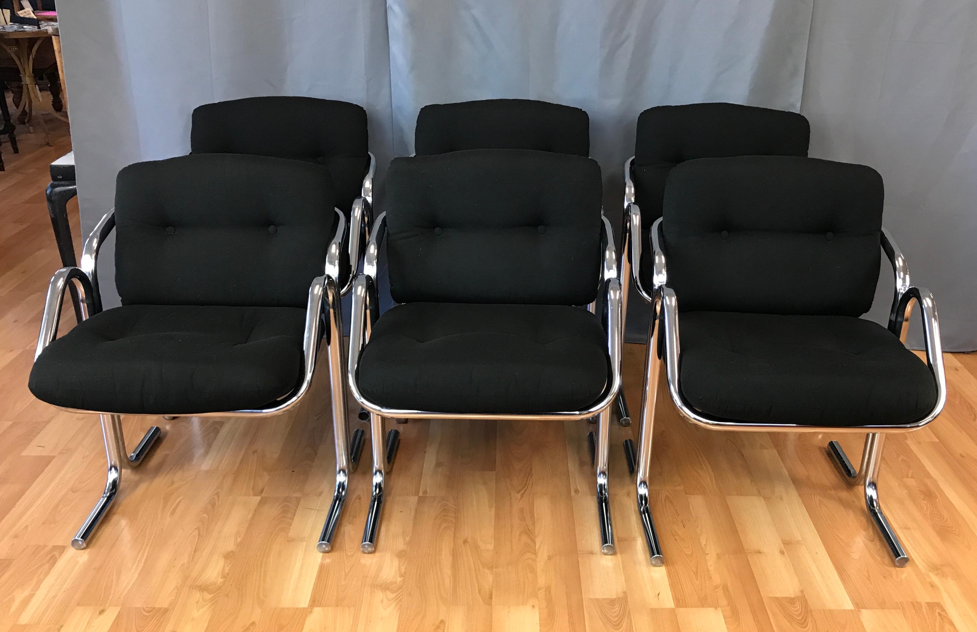 A striking and scarce set of six tubular chrome frame Arcadia dining chairs by Jerry Johnson for Landes Manufacturing.

Fantastic retro-futuristic lines defined by a pair of opposing chromed steel tubes that rise from the floor to curve around,