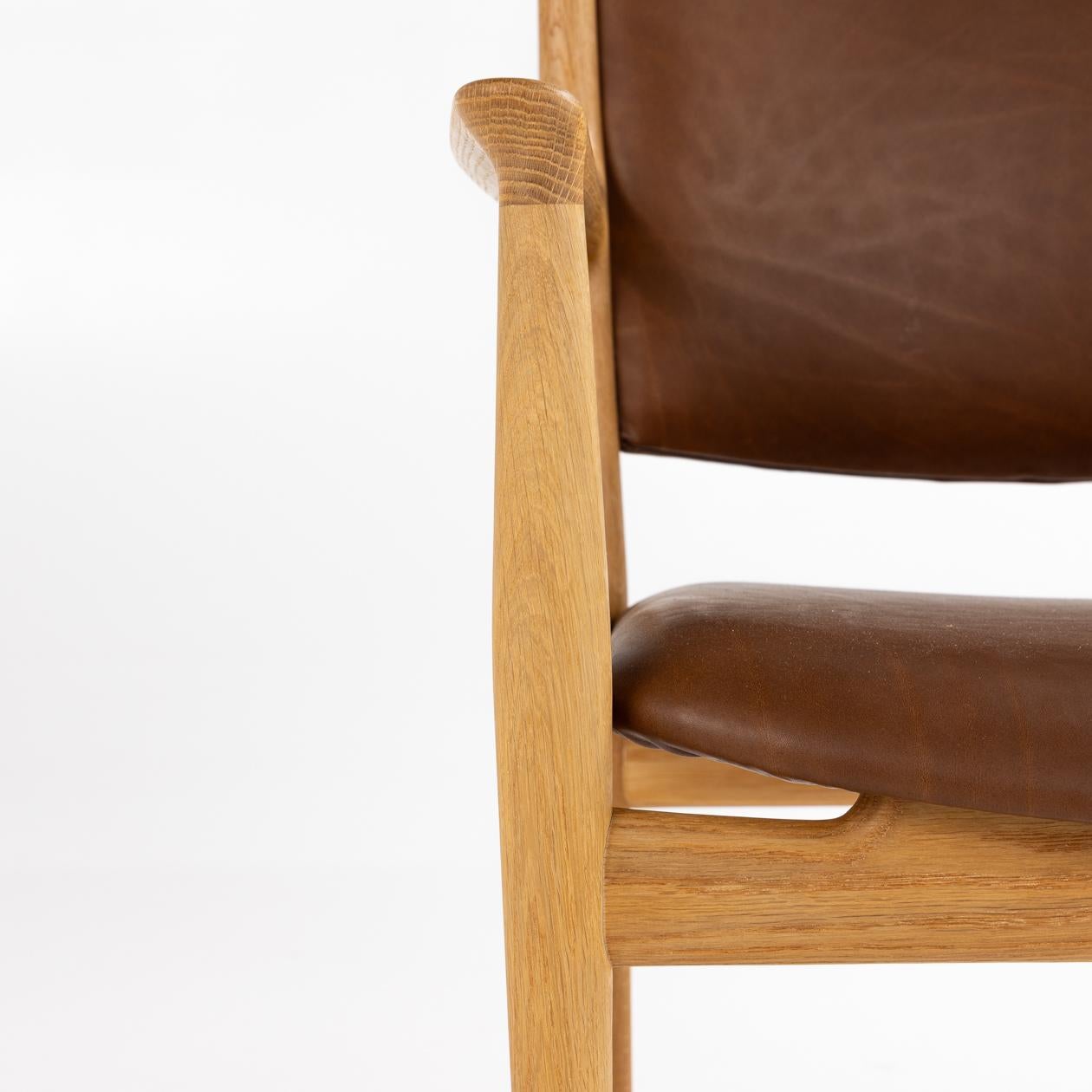 Six armchairs JH 513 in oiled oak and reupholstered in Vitoria 2369 Terra leather. Hans J. Wegner / Johannes Hansen
