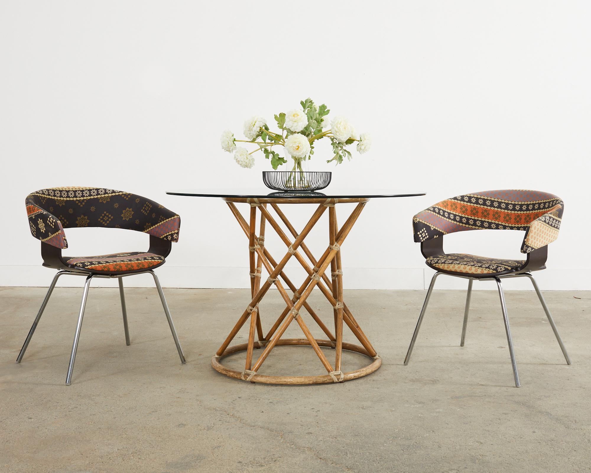Chic set of six post modern dining armchairs designed by John Coleman for Allermuir in the late 20th century. Known as the Mollie chair A580 with a gracefully curved walnut finished shell supported by chromed steel legs. The stylish chairs feature a