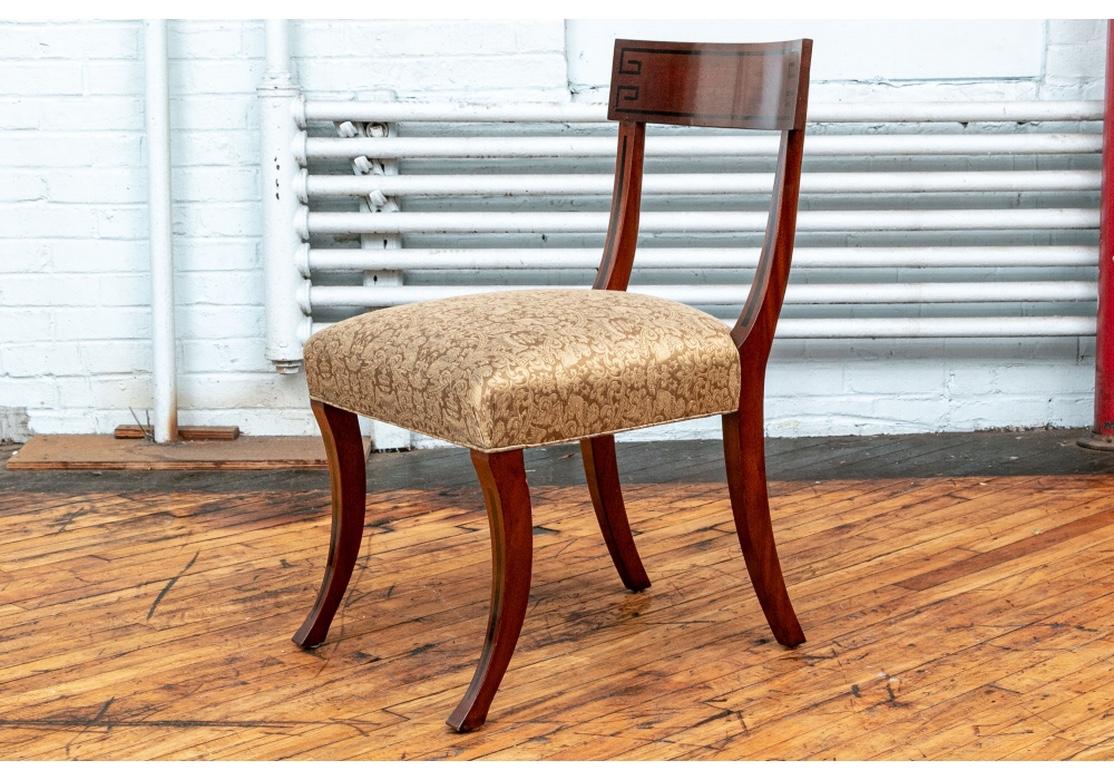 Fine set of six walnut with ebony inlay Klismos style chairs designed by Michael Smith and made by Jasper. The mahogany side chairs with ebonized key motifs on the curved backs. The side supports and square curved klismos stye legs decorated with