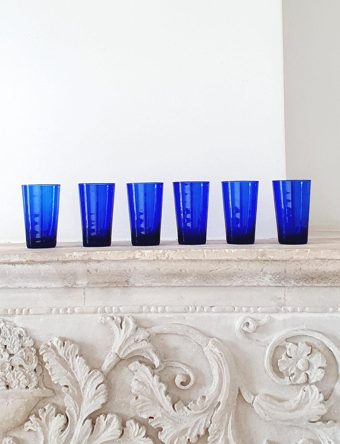 A set of six hand-blown amazing Empoli water glasses in vibrant blue. They are quite large (13cm tall) making them the perfect size for water glasses. Made in Empoli in the 1950s, they were found alongside a very few remaining pieces of Empoli