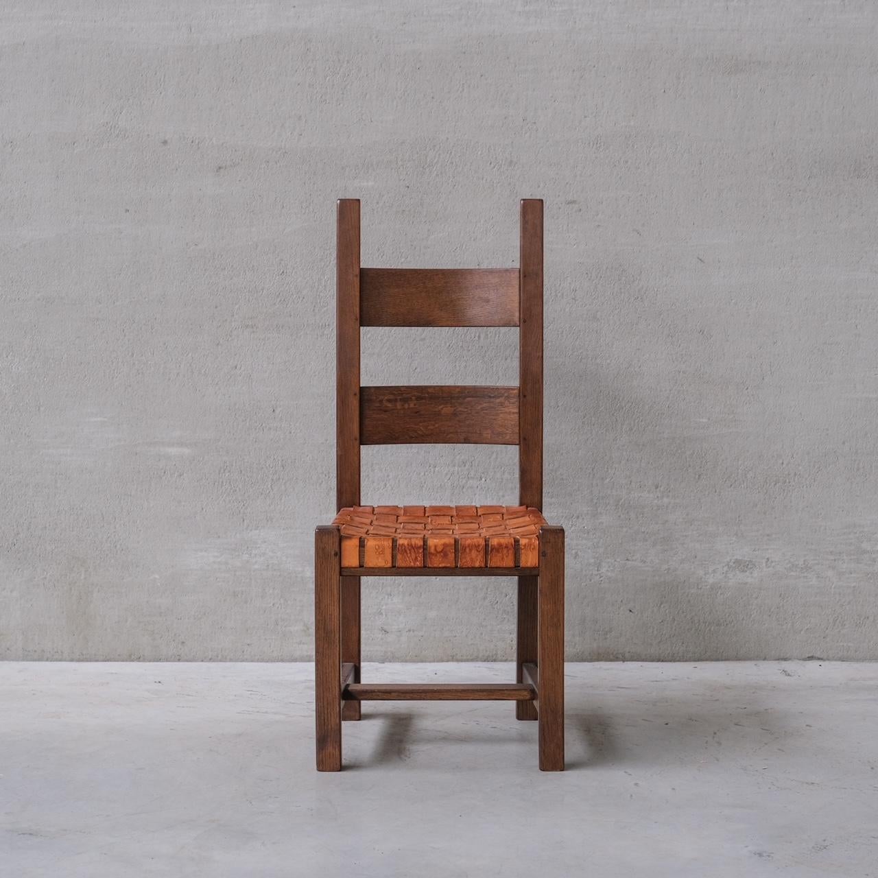 A set of of classy strap work leather dining chairs.

Holland, c1970s.

Wooden frames, believed to be oak.

Good quality and well executed design.

Good vintage condition, some scuffs and marks commensurate with age.

Location: Belgium