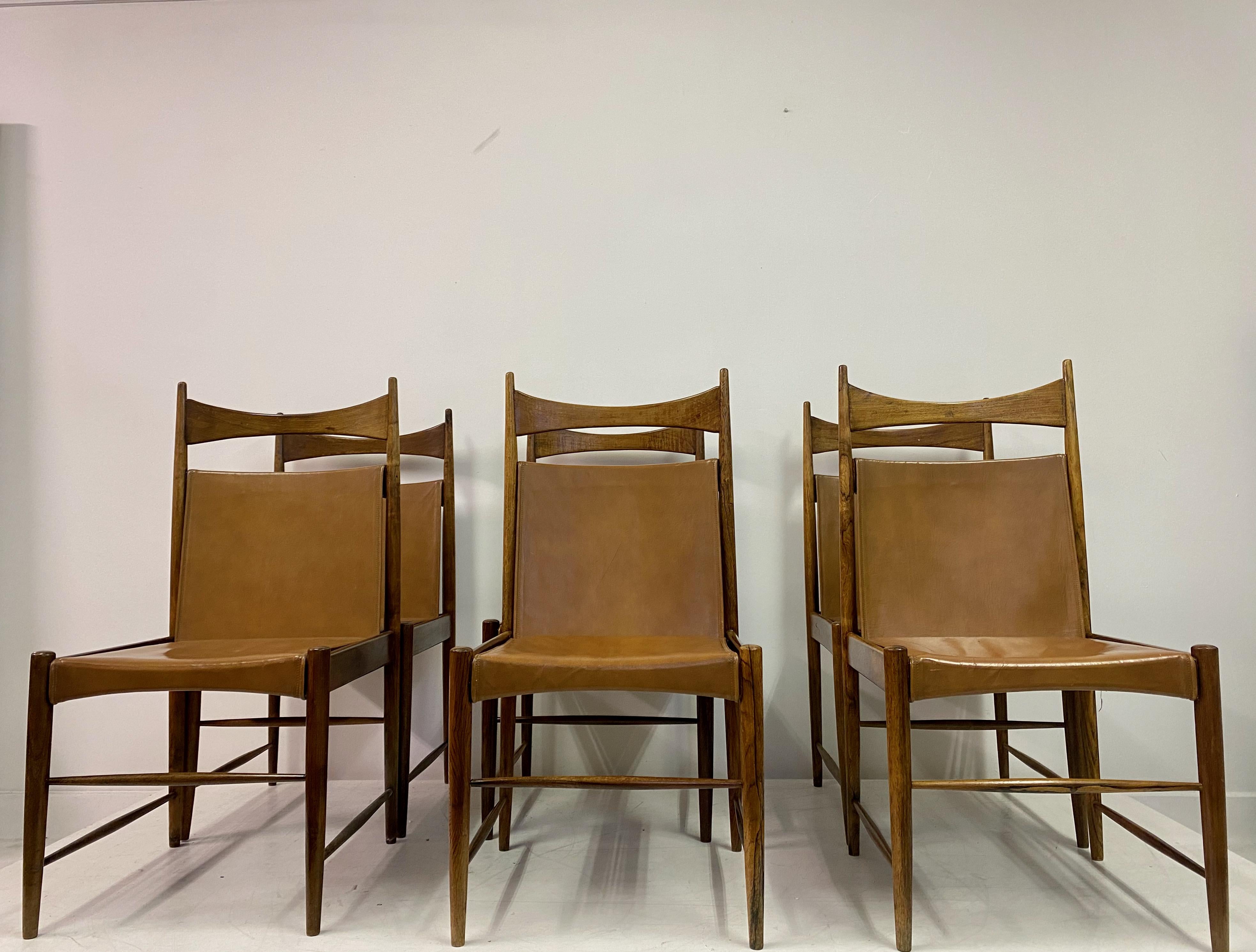 Six dining chairs

By Sergio Rodrigues

High back Cantu model

Tan leather sling type seats and back

Brazilian 1960s.

Frames will be refinished and polished before delivery.