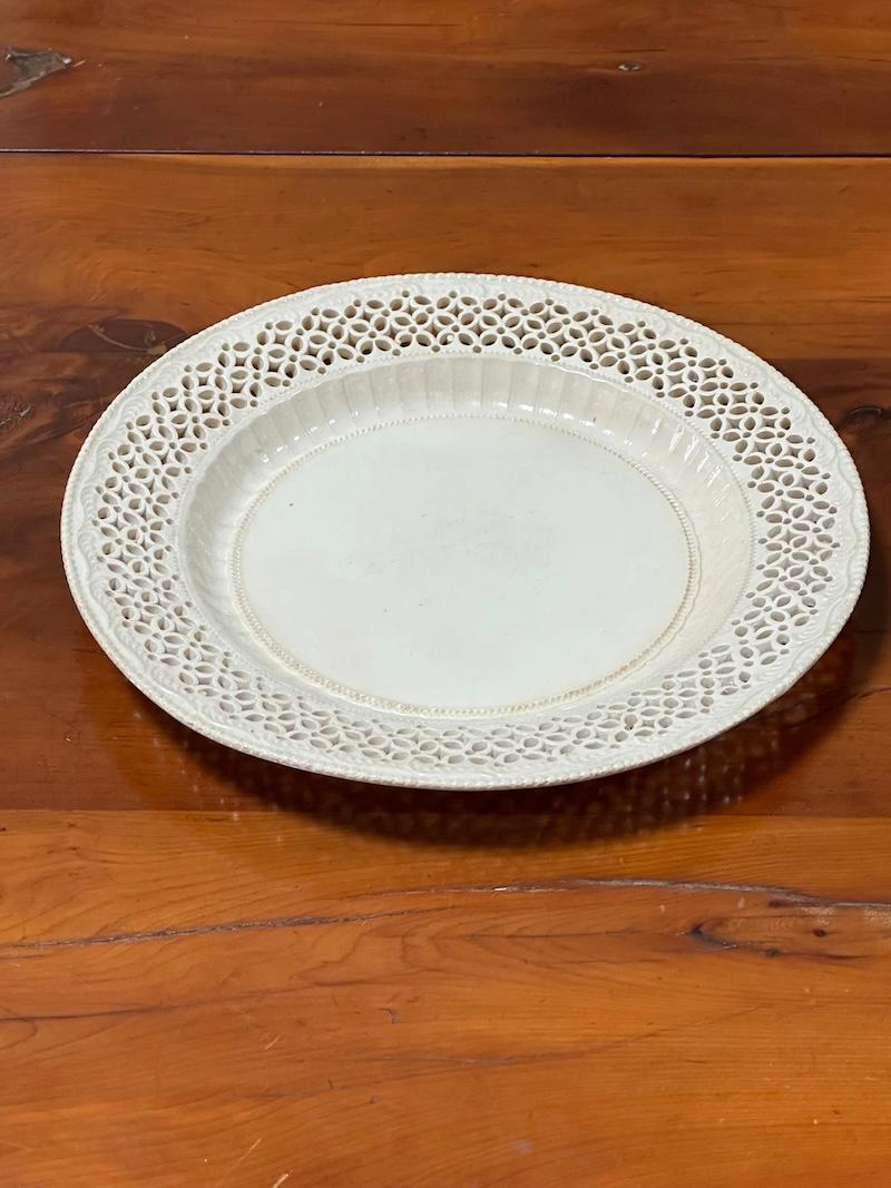 One set of six Leeds Creamware Reticulated Plates, 18th century, pierced with diamonds, dots and lozenges, along with molded beadwork diameter 9 3/8 inches.

