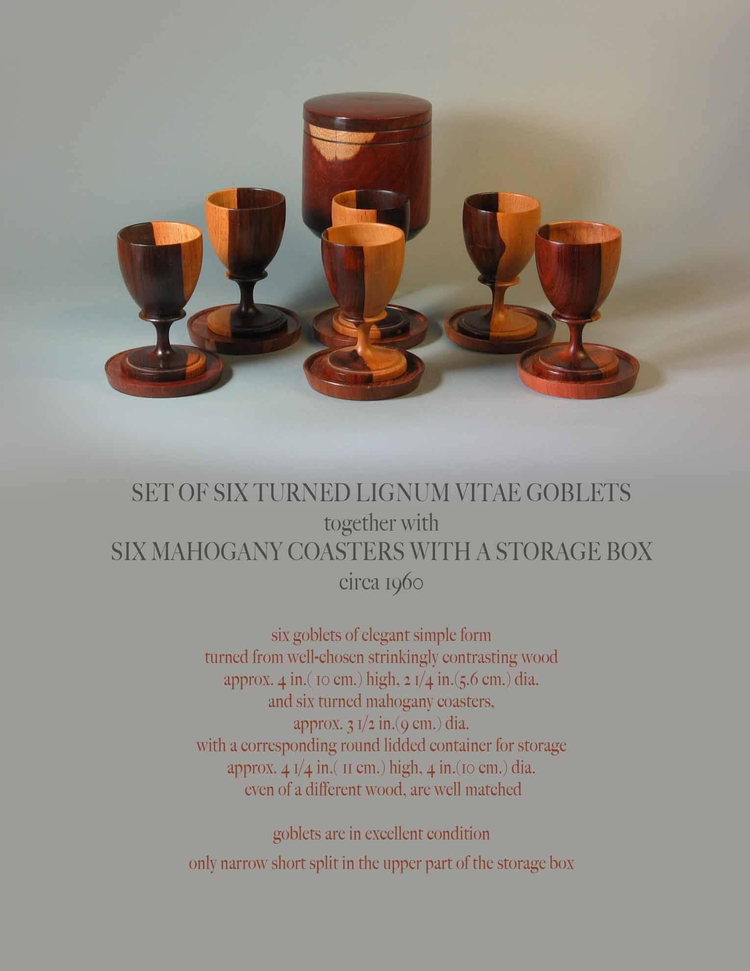 Set of six lignum vitae goblets together with six coasters with storage box, circa 1960. Six goblets of elegant simple form turned from well-chosen strickingly contrasting wood. Approx. 4