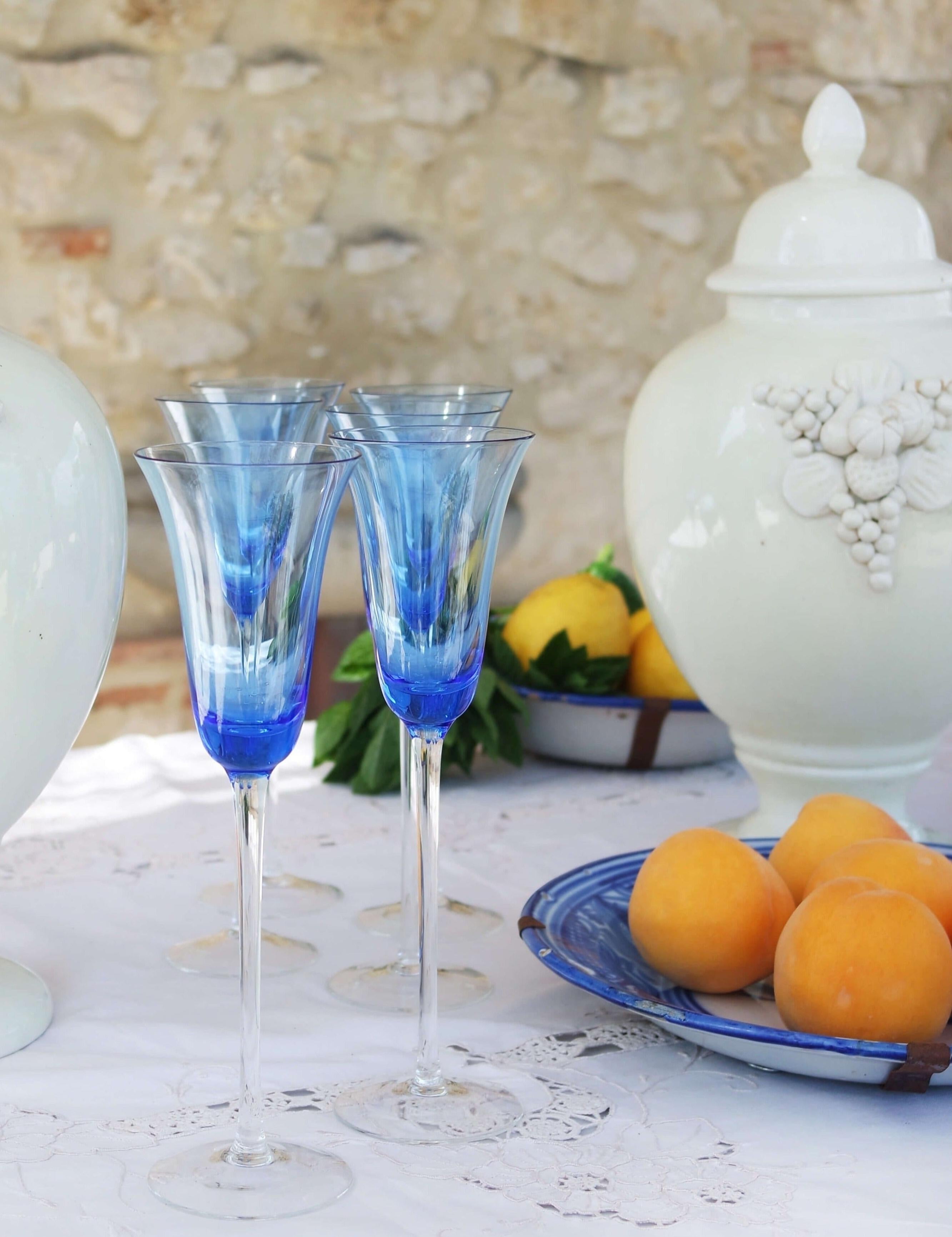 Set of six very tall blue hand-blown Italian wine flutes by Nason Moretti, the Murano glass blowing house in Venice. These glasses have extra long elegant stems and fine blue flutes. Made in the 1980s, they are all hand-blown and in excellent