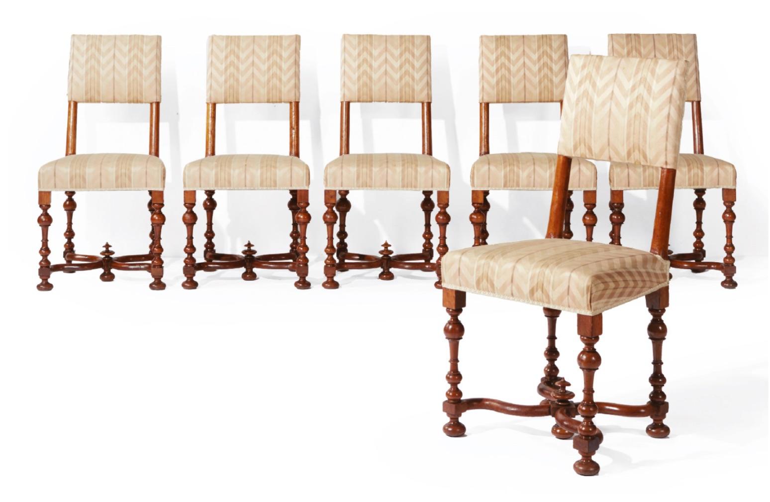 Set of six Louis XIII chairs
Origin: France
Period: 17th century, blond walnut wood
Very good condition.

Those tiny and elegant chairs with trapezoidal seats stand on four baluster feet. They are linked with a curved X-shaped crossbar centered