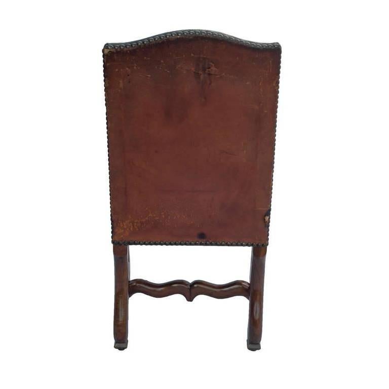Set of six Louis XIII dining chairs in walnut with original leather.