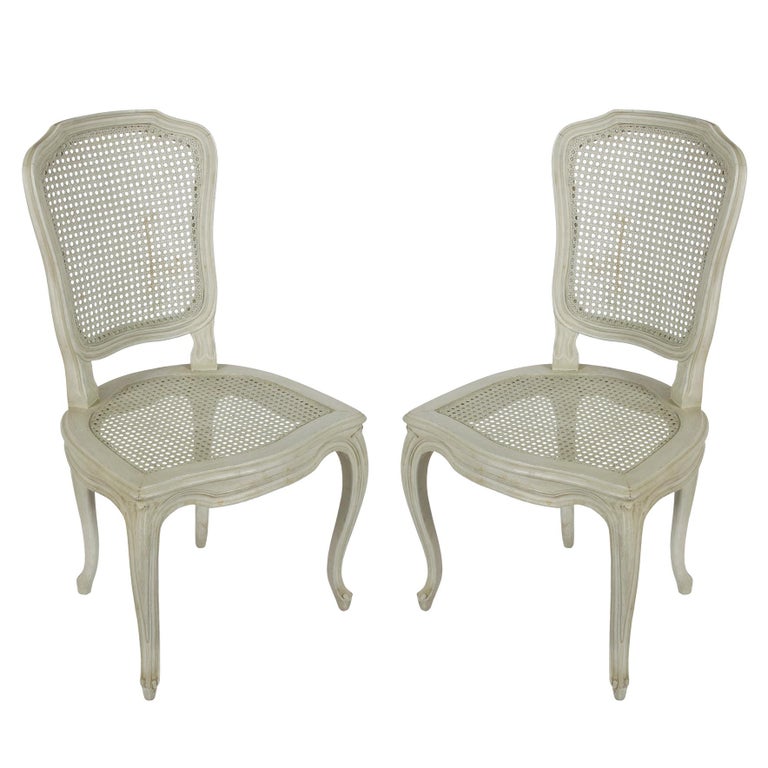 Set of six Louis XV style dining chairs with caned seats and backs.