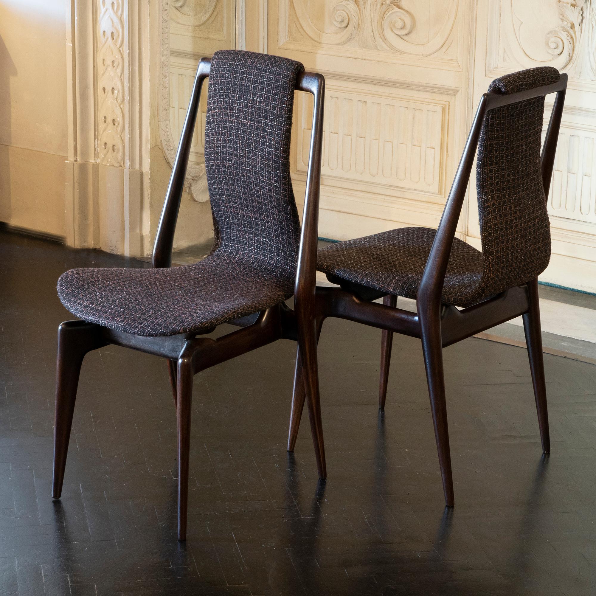 Set of six sculptural dining chairs, Mahogany structure, curved plywood seats newly reupholstered in black/brown jacquard fabric with a touch of light grey, Italy, 1950s.
