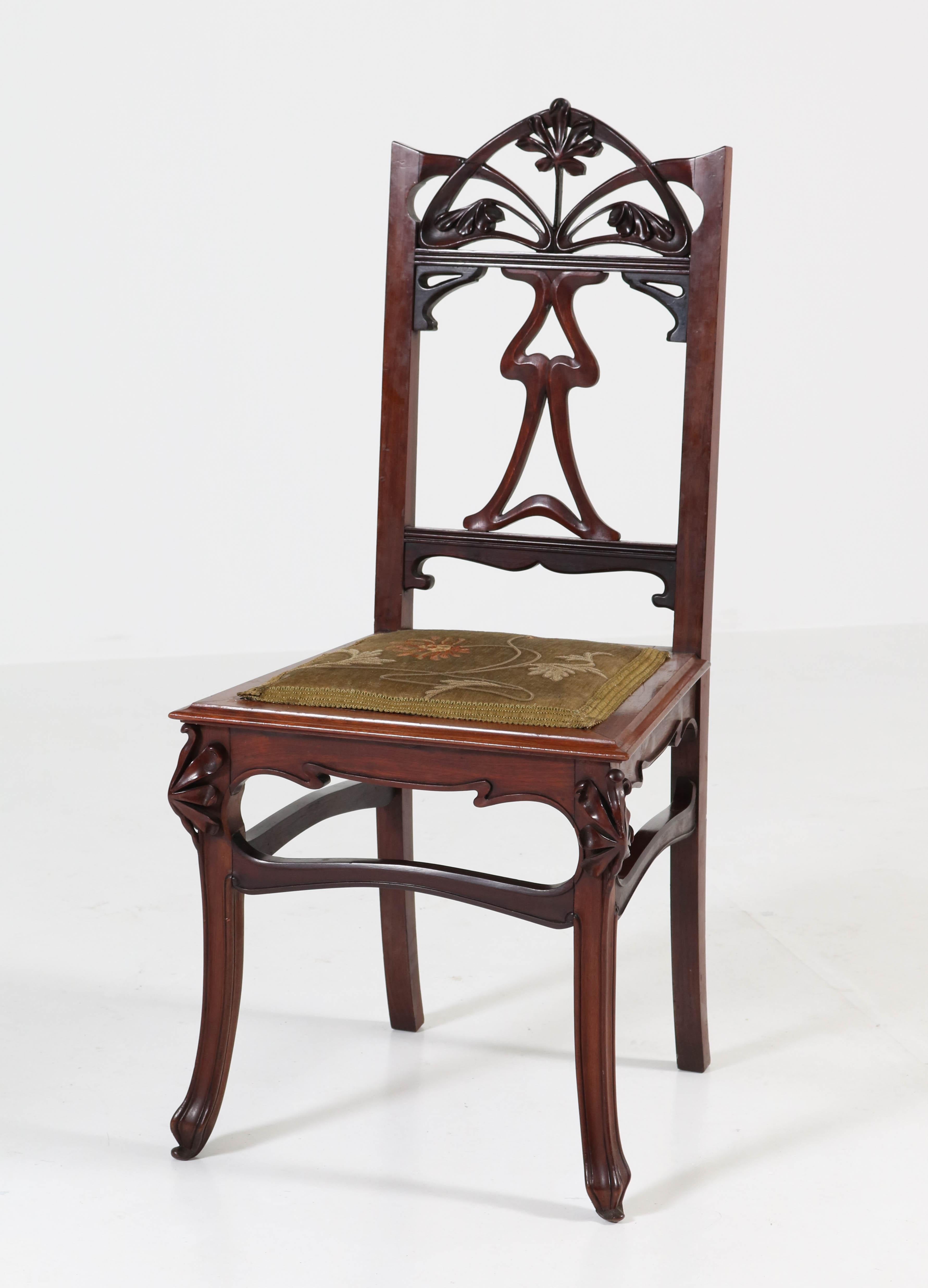 Offered by Amsterdam Modernism:
Wonderful and rare set of six Art Nouveau chairs.
Striking French design from the 1900s.
Solid mahogany with original velvet floral upholstery.
In good original condition with minor wear consistent with age and