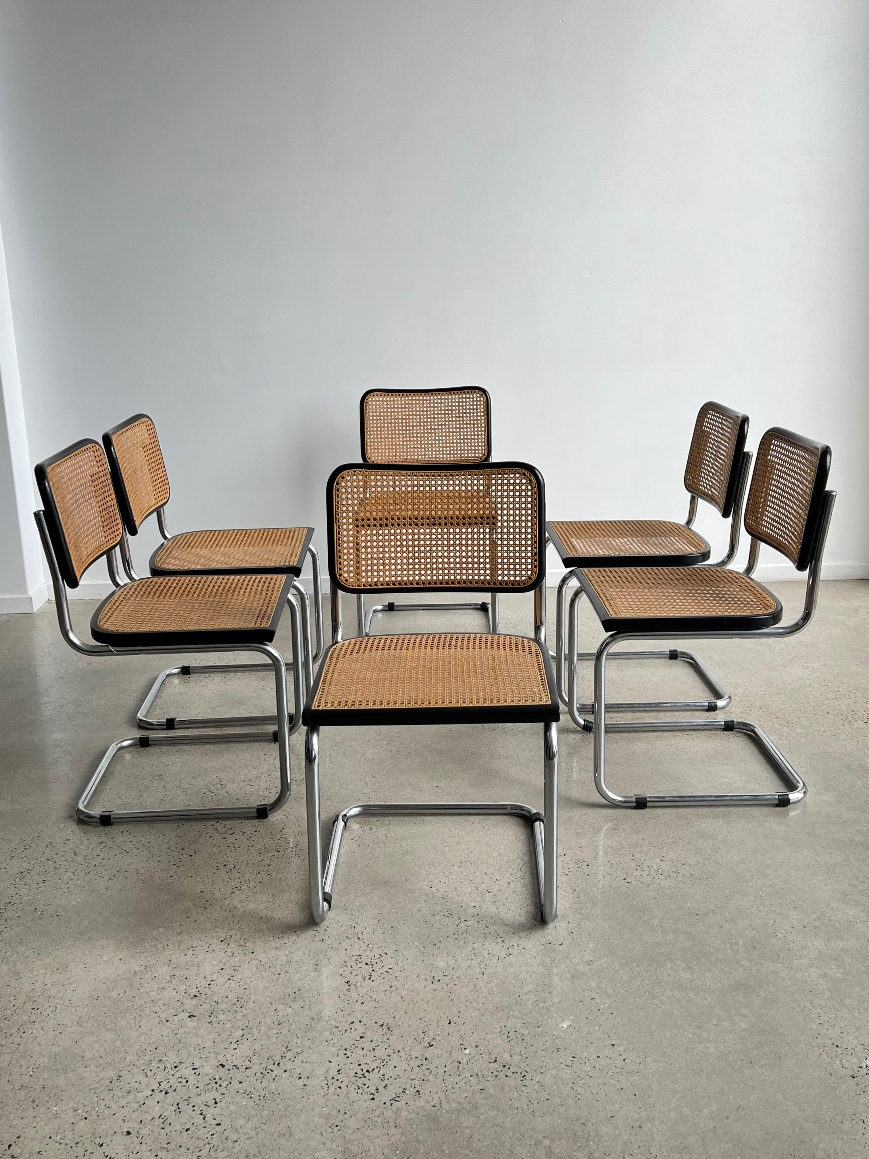 Set of two Cesca chairs, model B32, made in Italy in the 1970s. Black lacquered beech wood frames and Viennese natural grid. The grills of the two seats and backs have been put new. Very good general condition.