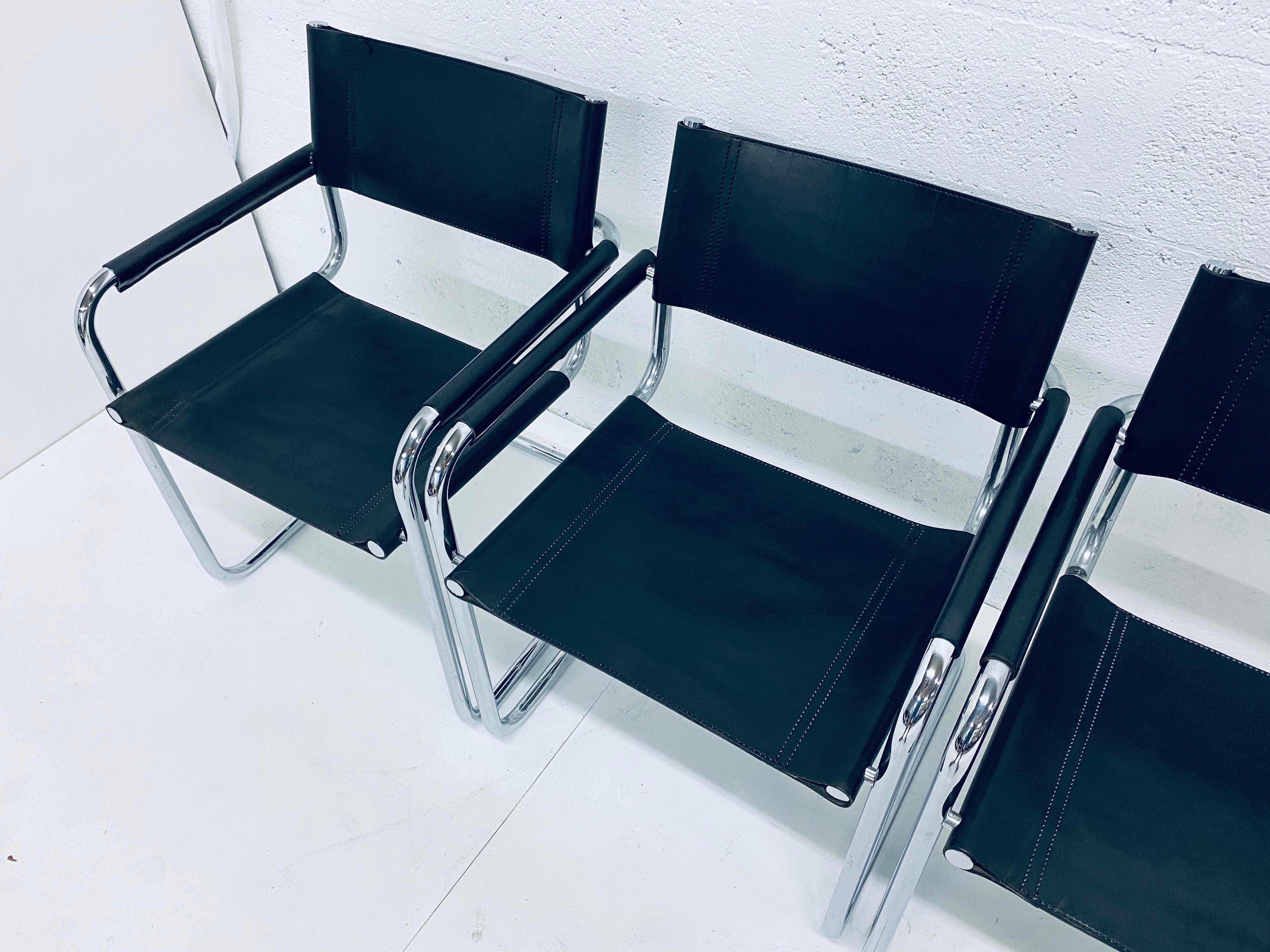 Set of six Bauhaus modern black leather and tubular chrome dining arm chairs by Mart Stam for Fasem from the 1970s.
