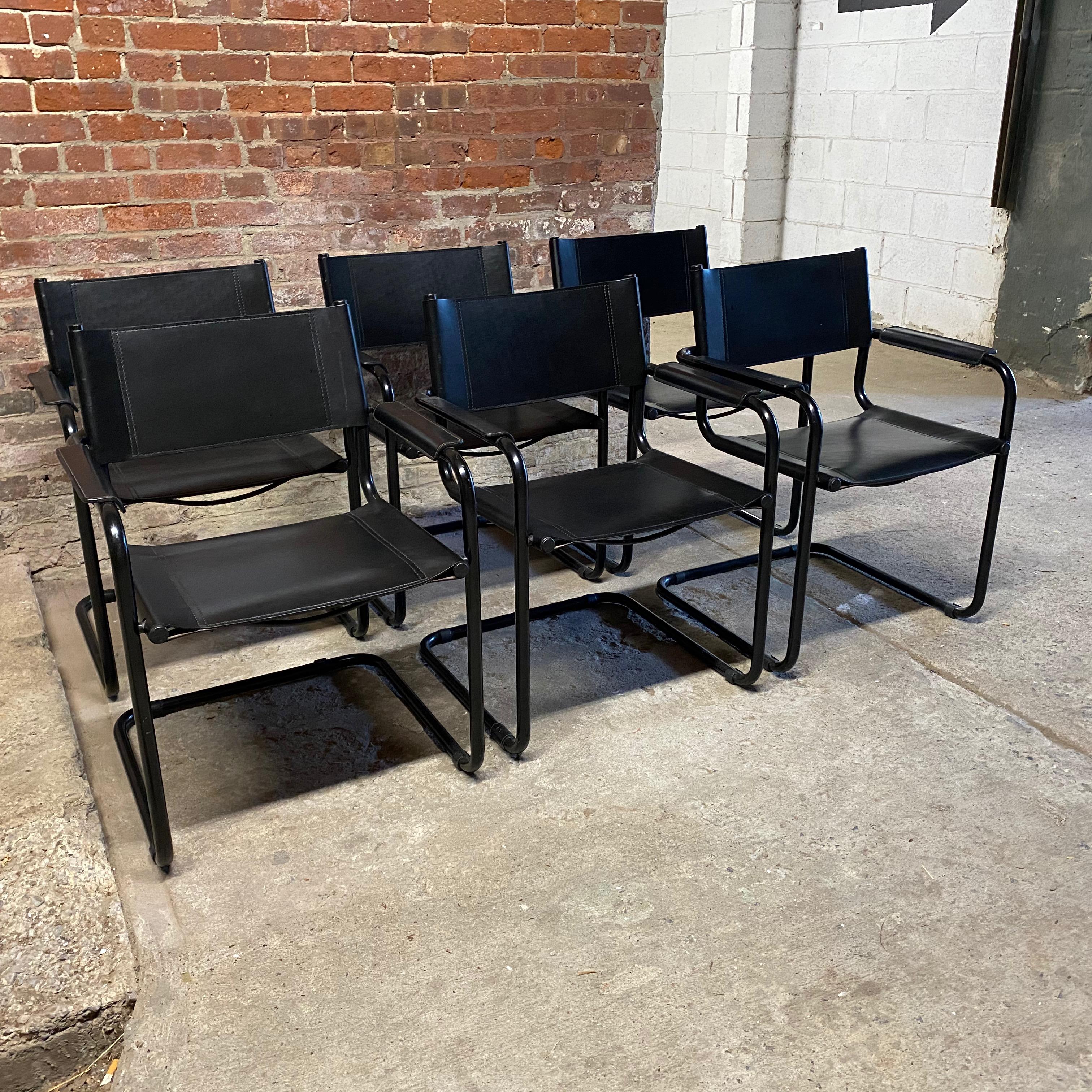 Set of six Matteo Grassi style MG5 cantilever chairs. Thick hard black leather sling backs and seats with a contoured arm rest. The original design, by Marcel Breuer has often been reproduced, but not like the quality of the Grassi chairs. Black