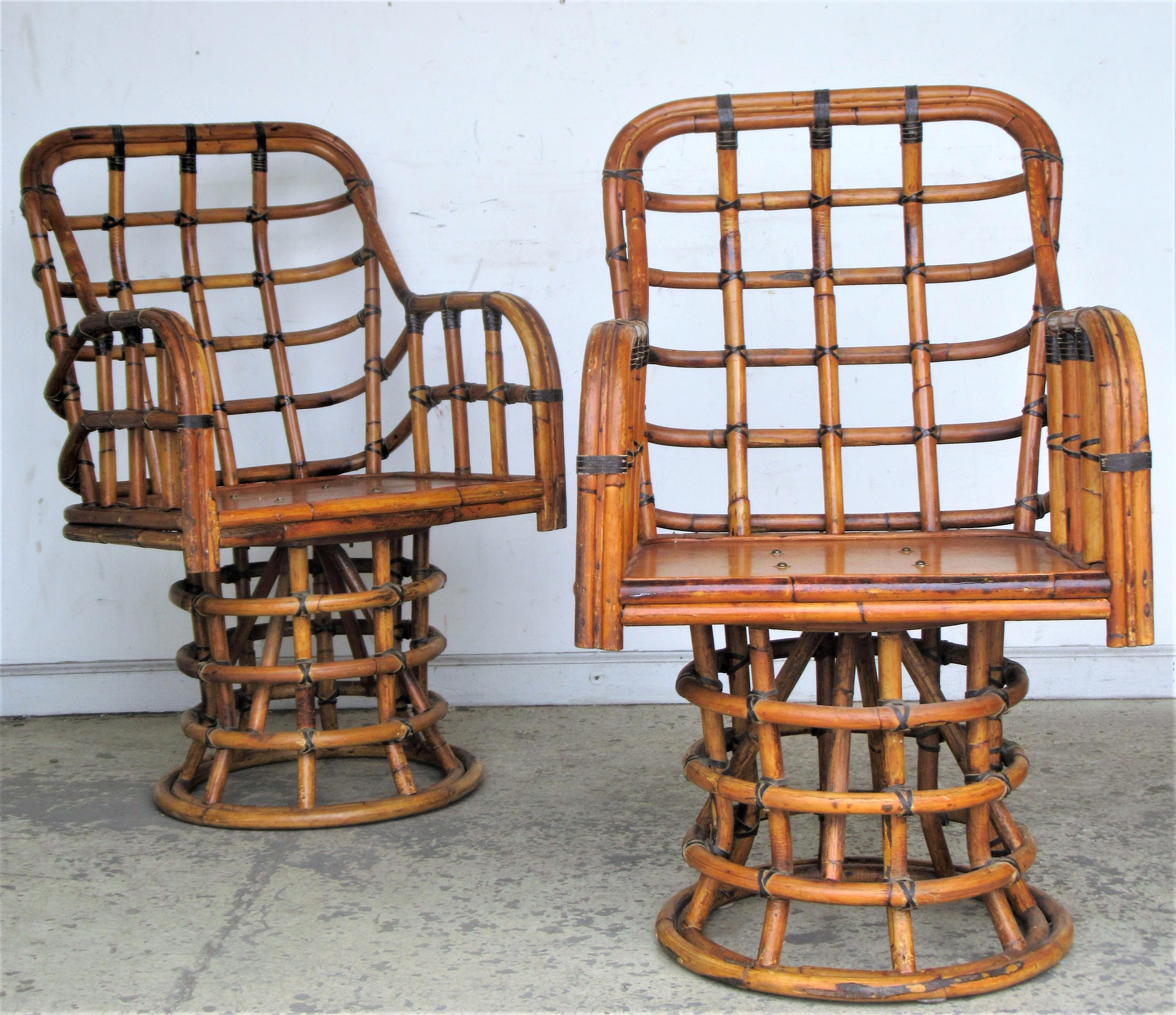 A great looking set of six matching ash wood faux bamboo swivel lounge / dining arm chairs with black leather bindings. All chairs are in overall beautifully aged original old surface color, Crca 1950. Look at all pictures read condition report in