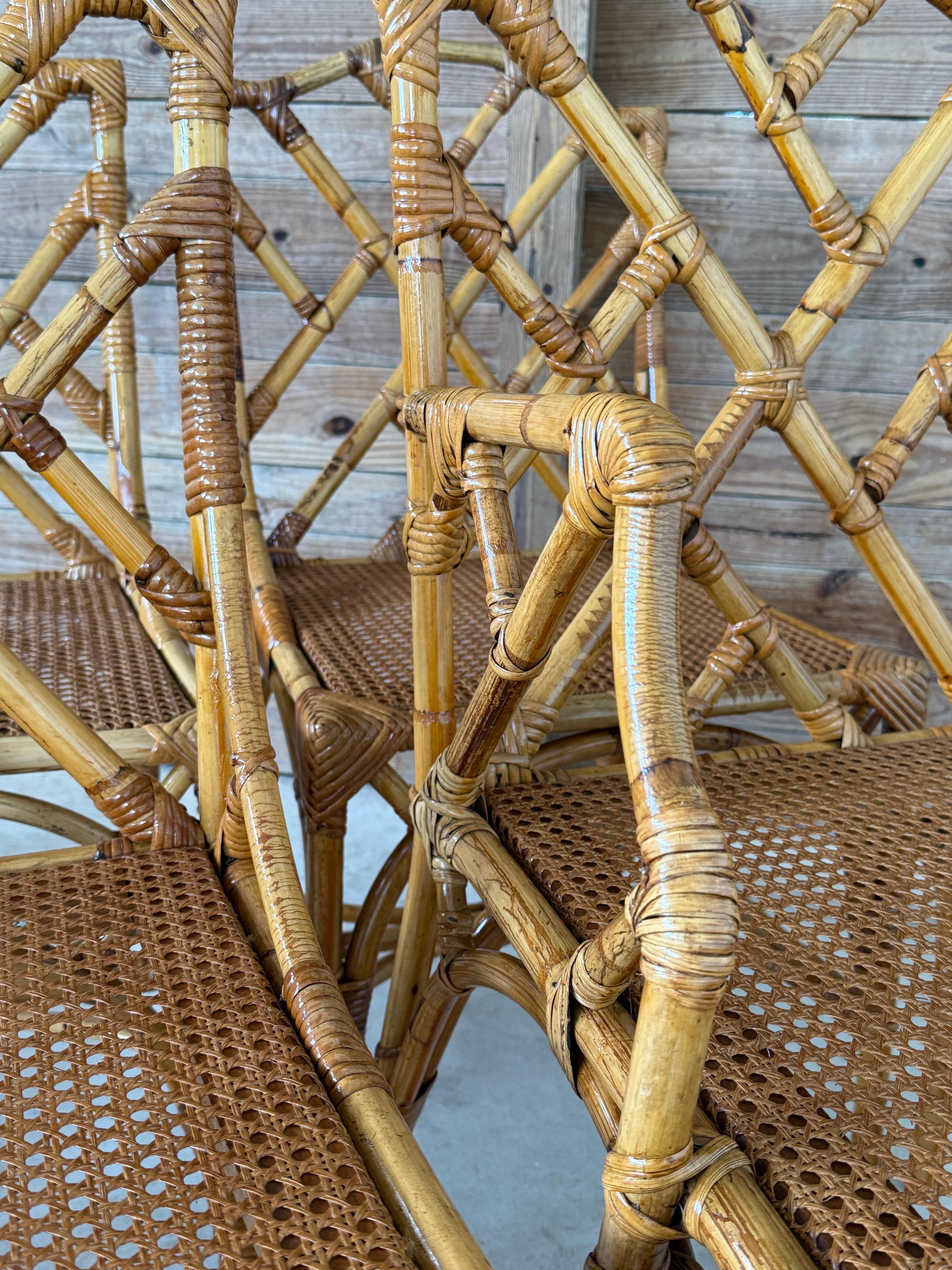 A stunning set of six Mid-20th Century Italian rattan dining chairs, beautifully restored and refinished. Crafted in the classic Chippendale style, each chair showcases intricate fretwork backs and newly woven cane seats. These were handmade in