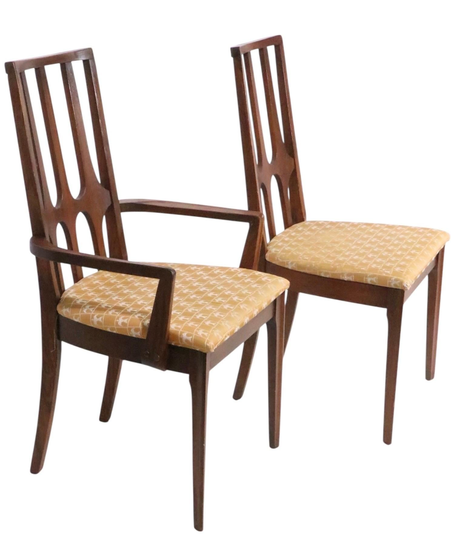 Rare set of Mid Century Brasilia dining chairs, made by the Broyhill Furniture Company circa 1960's. The chairs  feature the signature sculptural elongated  diamond form back supports, reminiscent of the modernist architecture of 1960's Brazil. This