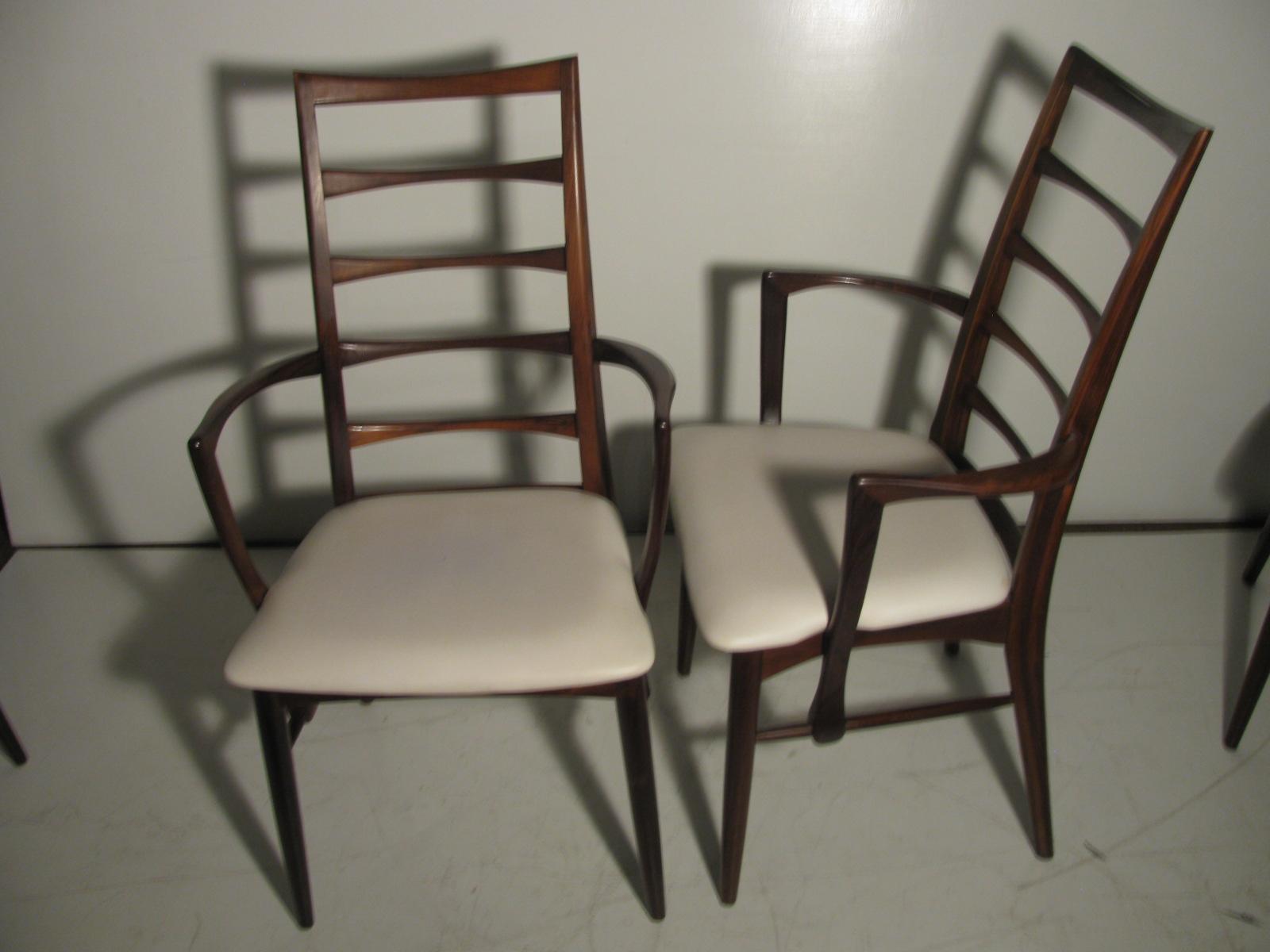 Elegant and beautiful set of six ladder back solid rosewood dining chairs model Lis, with white leather seats. Set consists of two armchairs and four side chairs. All in amazing vintage condition. Designed and manufactured by Niels Koefoed in the