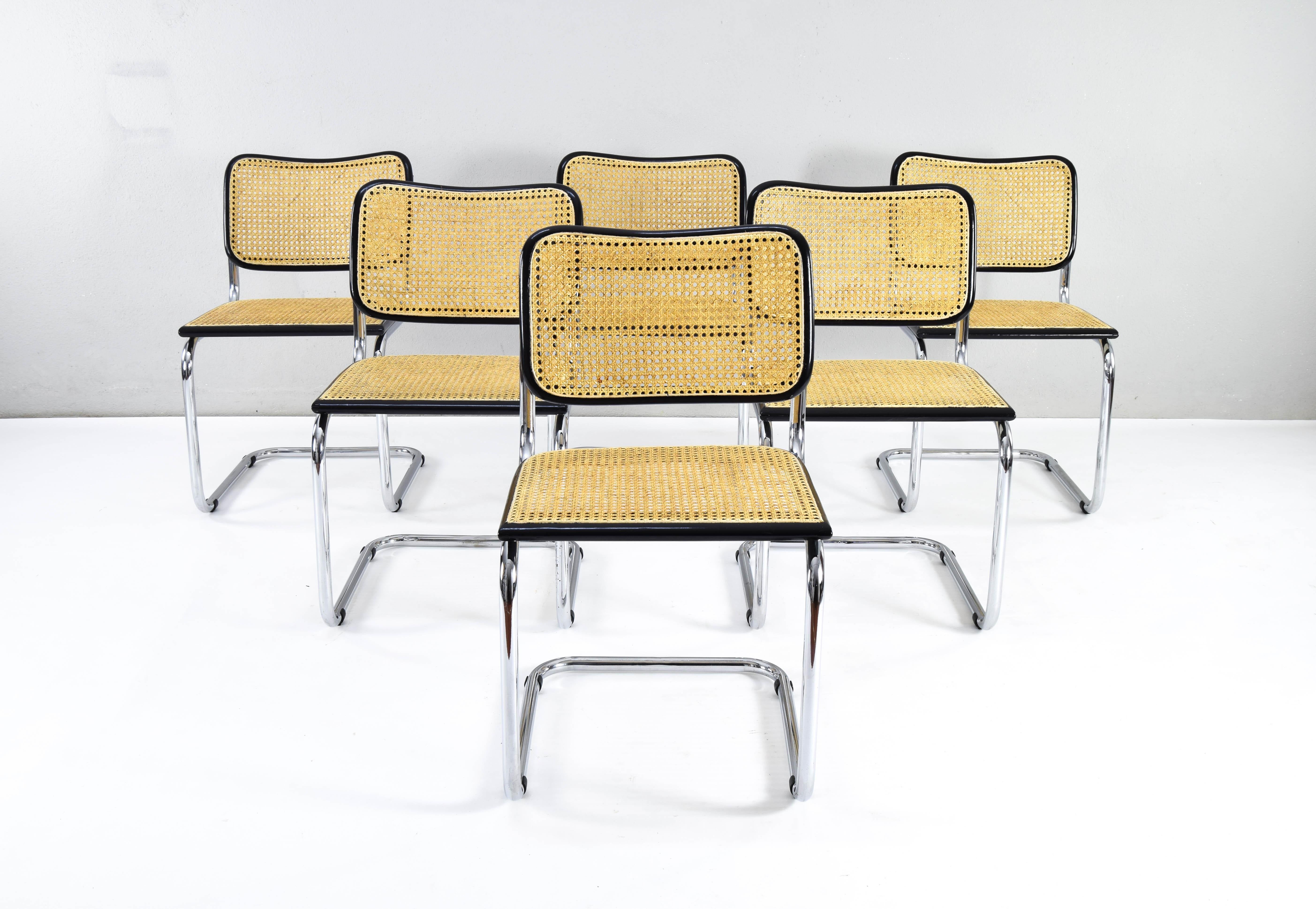 Set of six Cesca chairs, model B32, made in Italy in the 1970s.
Some show signs of wear on the chrome but in general they are in good condition. 
Black lacquered beech wood frames and natural Viennese grille.
The grids of the six chairs have been