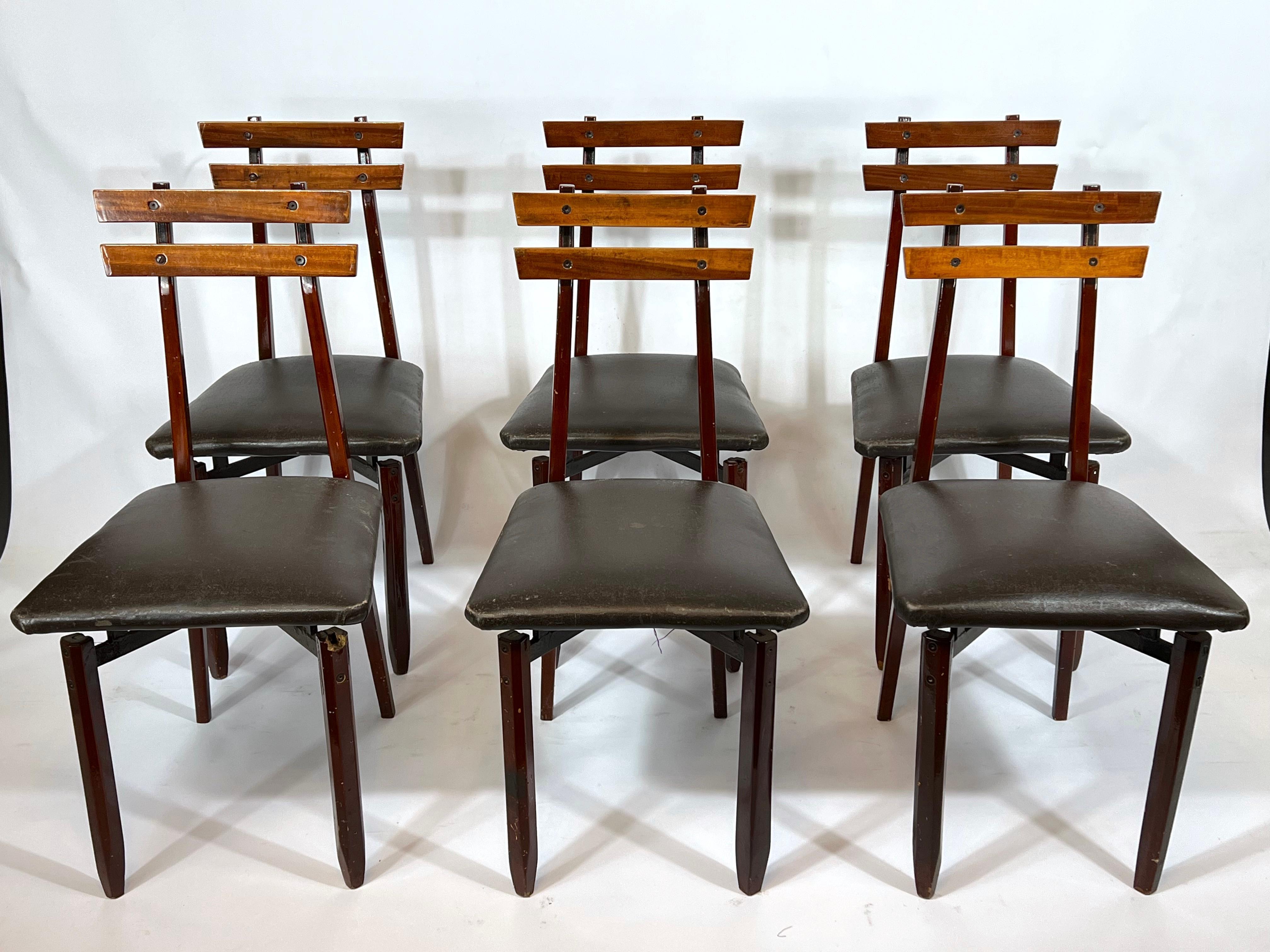 Vintage condition with evident trace of age and use for this set of six wood chairs from 50s.