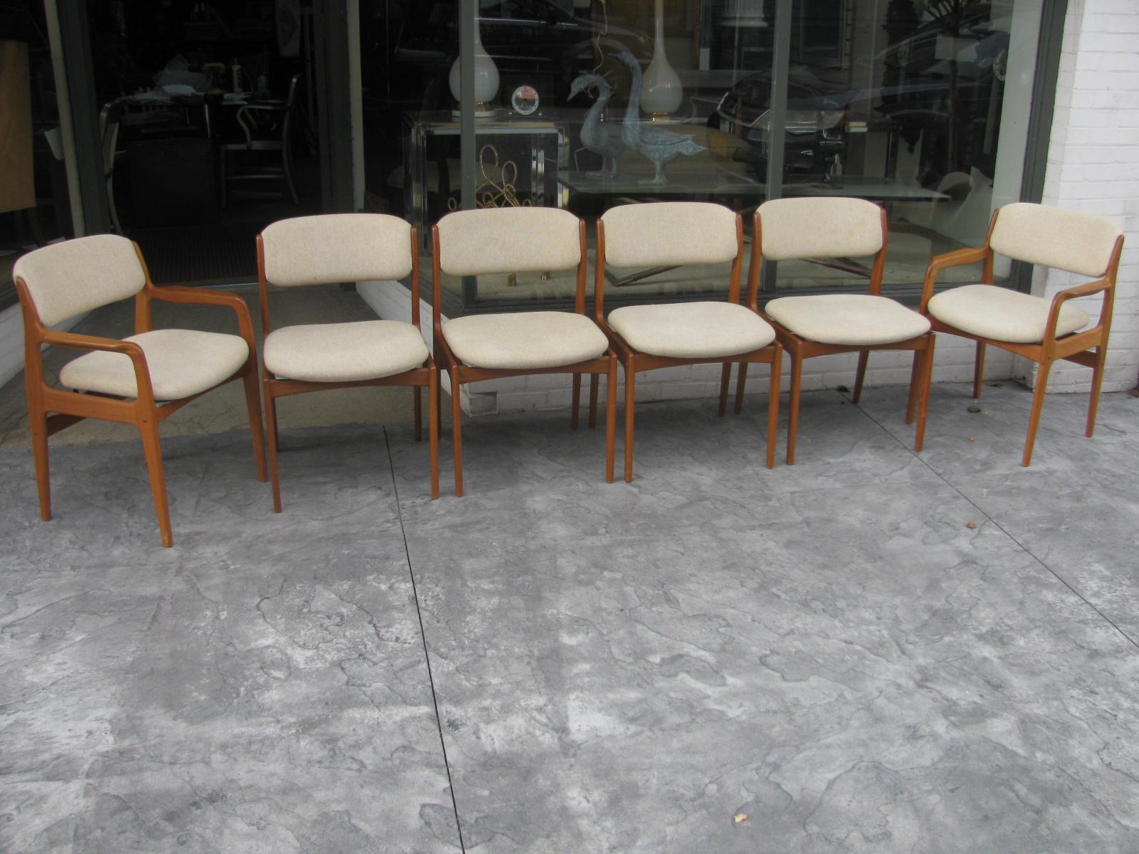 Beautiful set of six sculptural teak Danish dining chairs by Benny Linden. Set consists of two armchairs and four sides. Armchairs are 22.5in wide, sides are 20in wide. Fabric, wool blend and original is in very good used condition with some