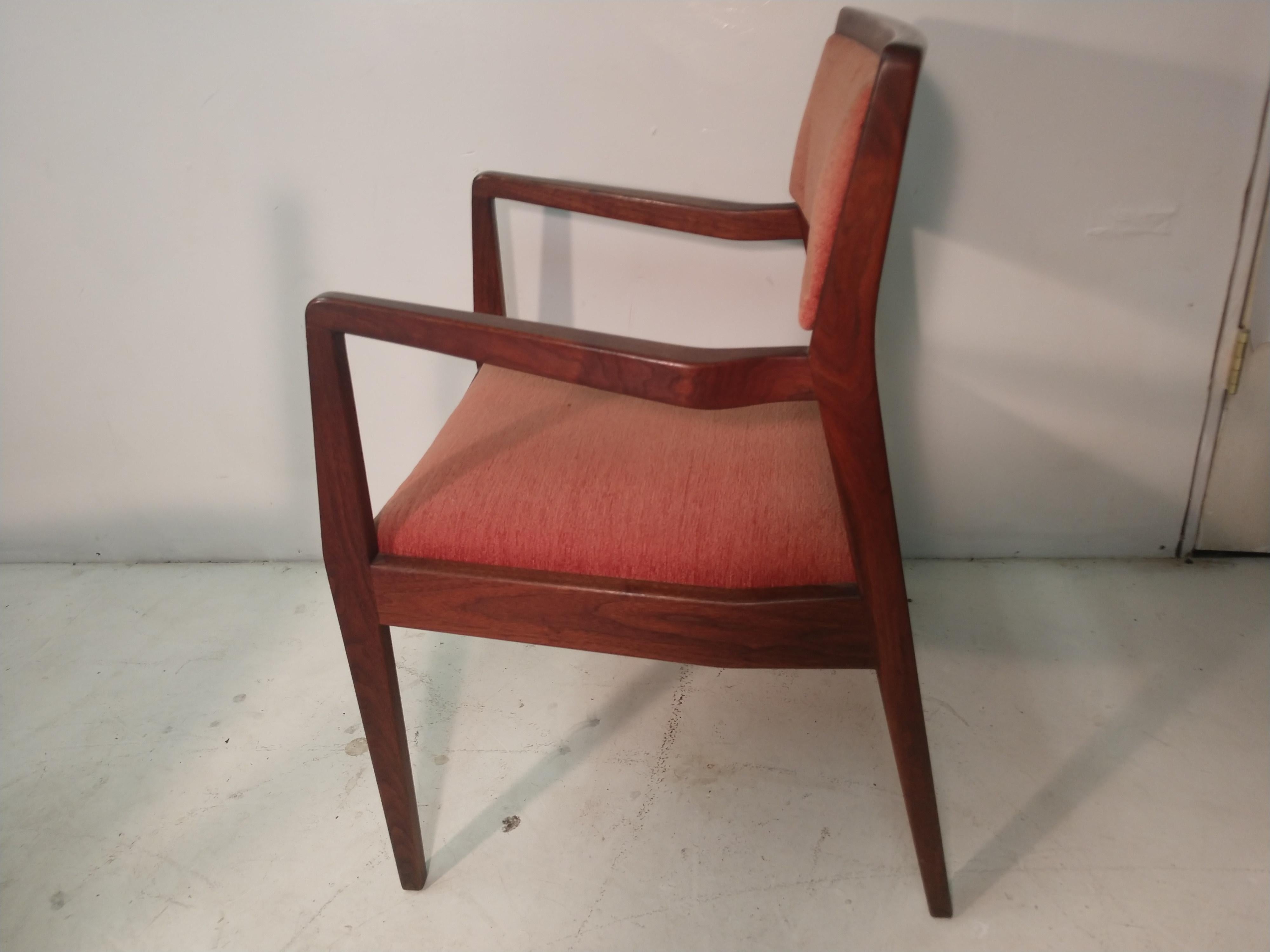 Fabulous set of 6 dining chairs by Jen's Risom. These are the playboy chairs as they were featured in a article on modern furniture in the magazine. 2 arm and 4 side chairs in walnut comprise the set. Excellent vintage condition and very