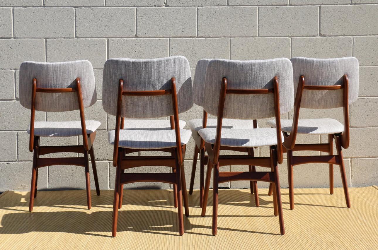 Amazing mid century modern set of six dining chairs designed by Louis van Teeffelen for Webe. Originally from Netherlands, circa 1950. (They have no attribution mark). These chairs are made of solid teak wood, they have been refinished and