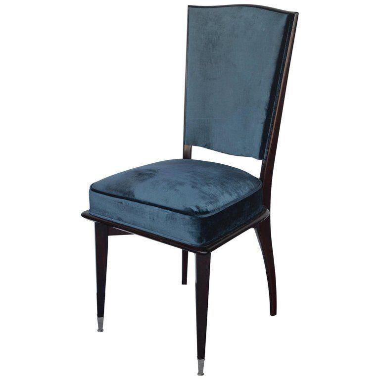 Set of six Mid-Century Modern dining chairs. Newly upholstered in a dark peacock color that compliments the mahogany on the chairs. The two front feet are accented with chrome caps.