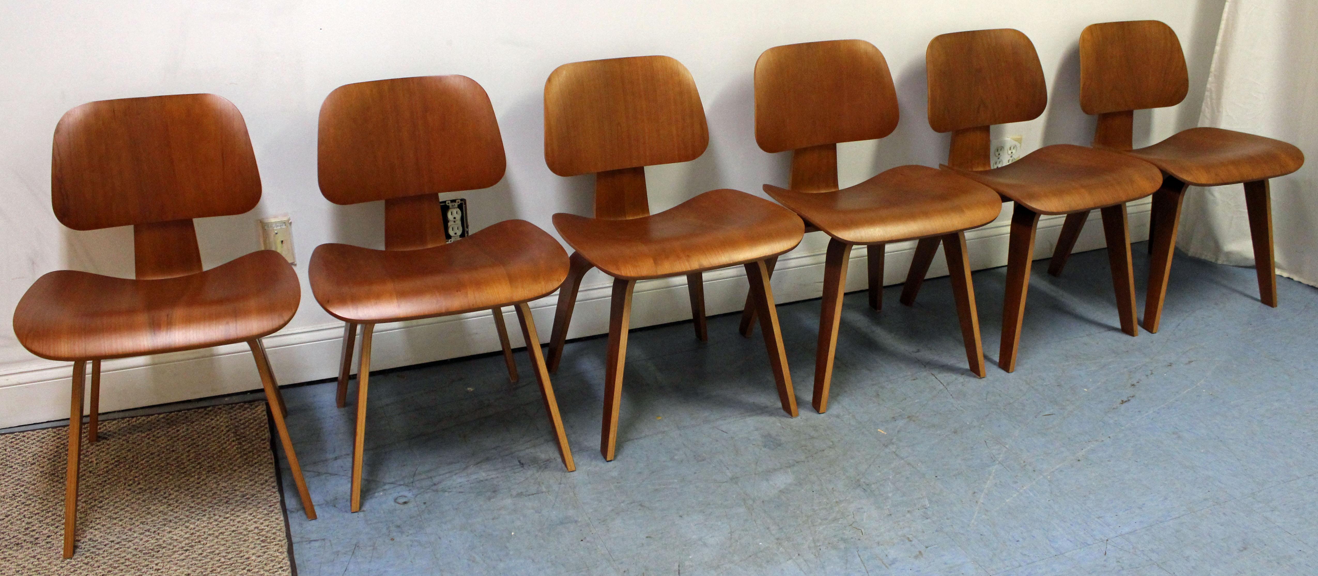 What a find. Offered is a very cool set of six Mid-Century Modern dining chairs, designed by Eames for Herman Miller. These chairs are made of molded plywood in a natural cherry finish. Expertly crafted with a molded seat and back, this chair
