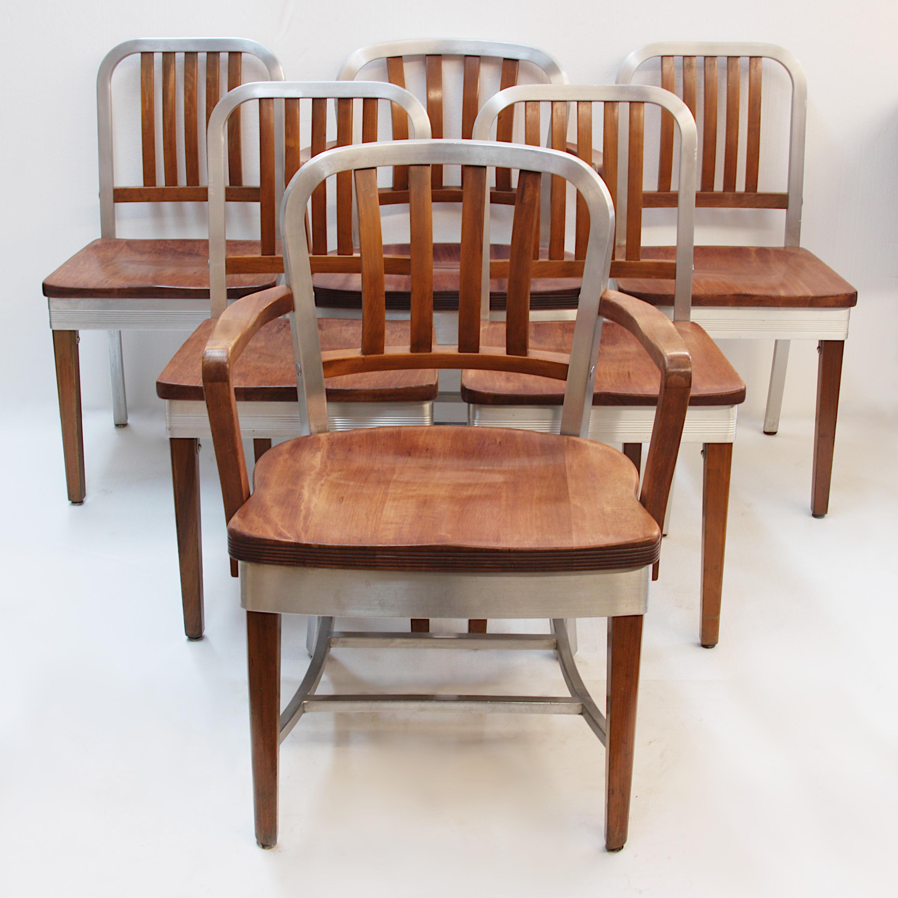 Wonderful set of 6 dining chairs by the Shaw Walker Company of Muskegon, MI. Set includes two arm chairs and 4 standard chairs (surprisingly the arm chairs and standard chairs share no common parts!) These chairs feature an iconic design that