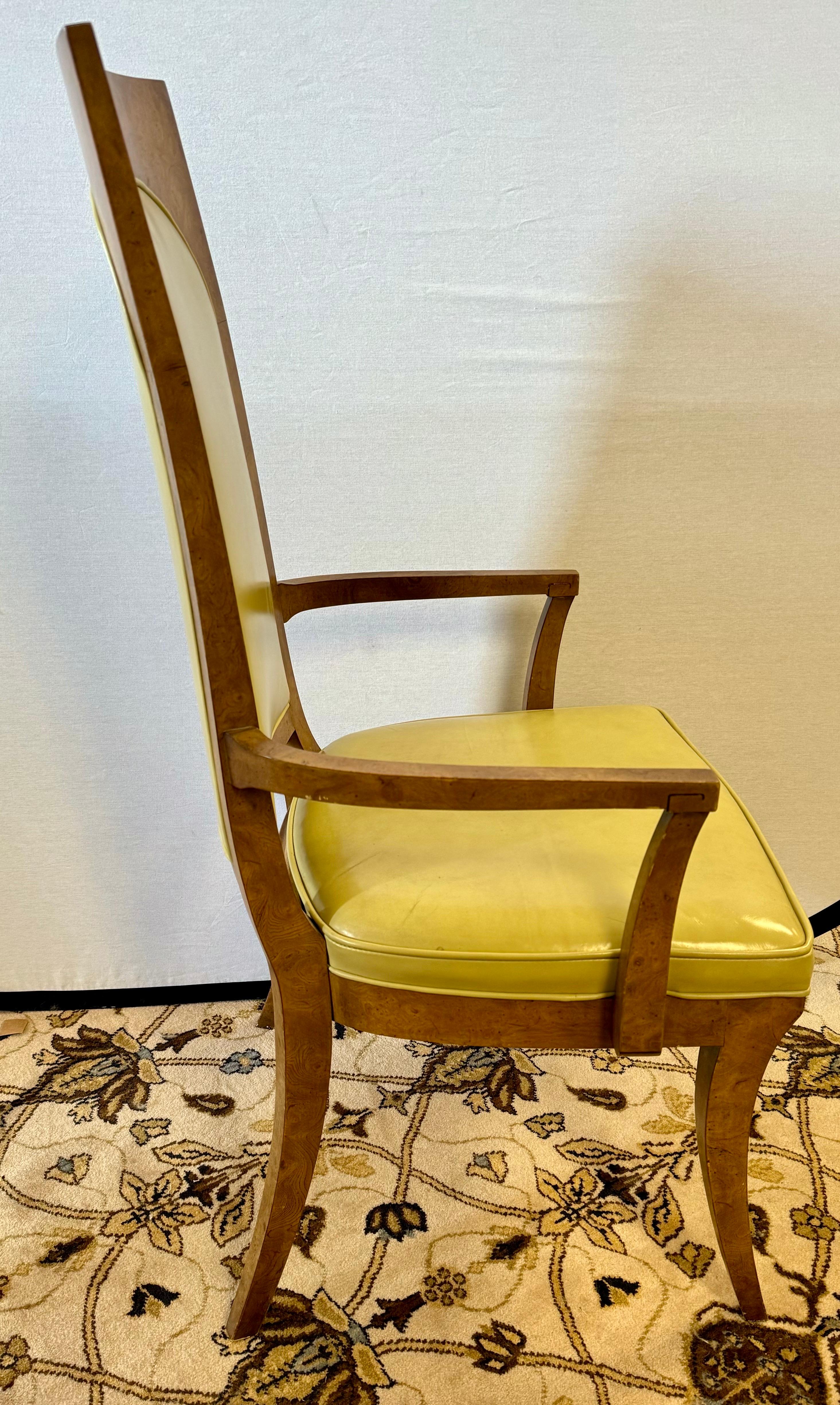 Iconic mid century Mastercraft burlwood dining chairs showcase the unique beauty of burlwood, featuring rich swirling patterns that add a touch of elegance to any dining space.  The epitome of 